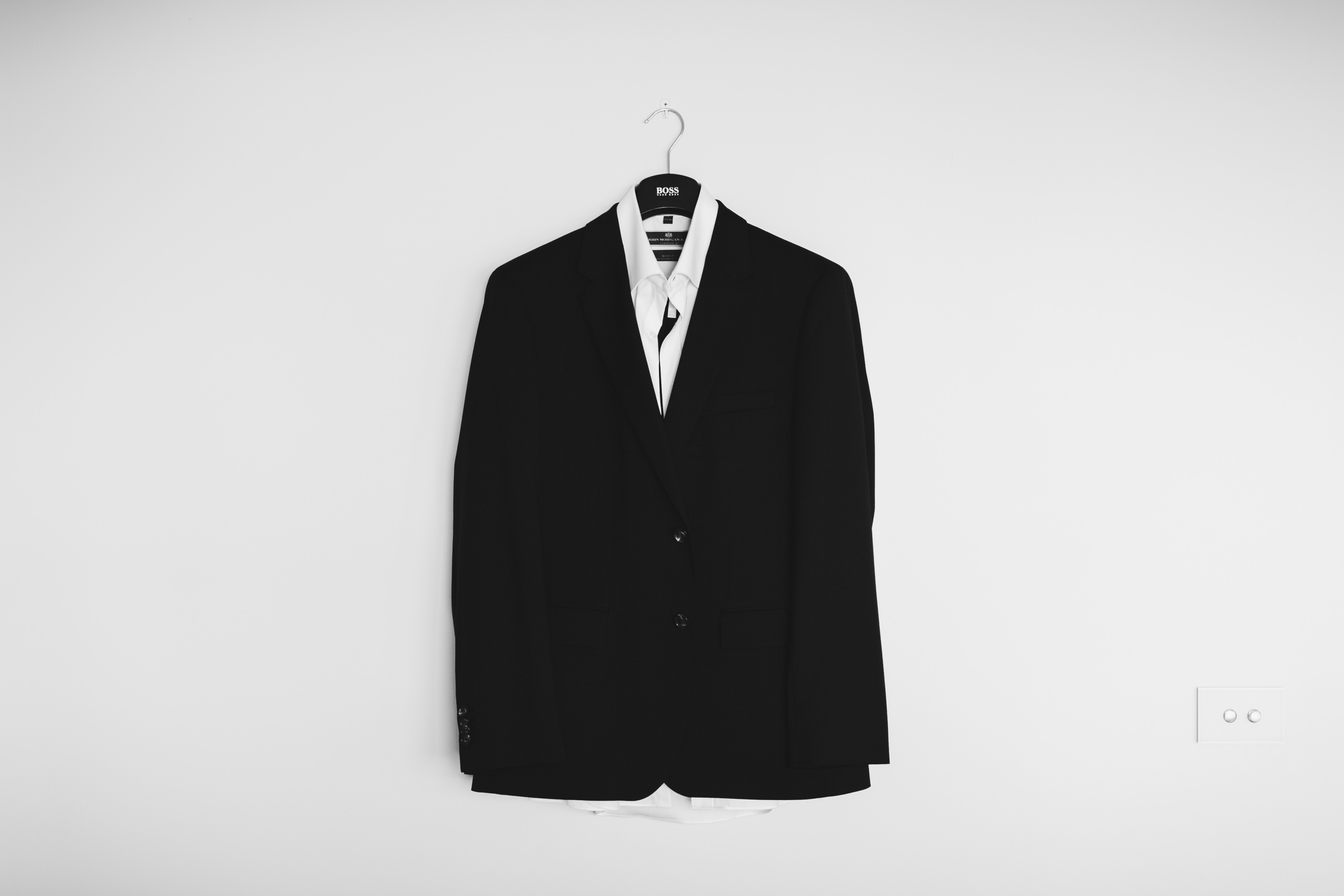 Black BOSS suit jacket and white shirt on hanger HD Wallpaper