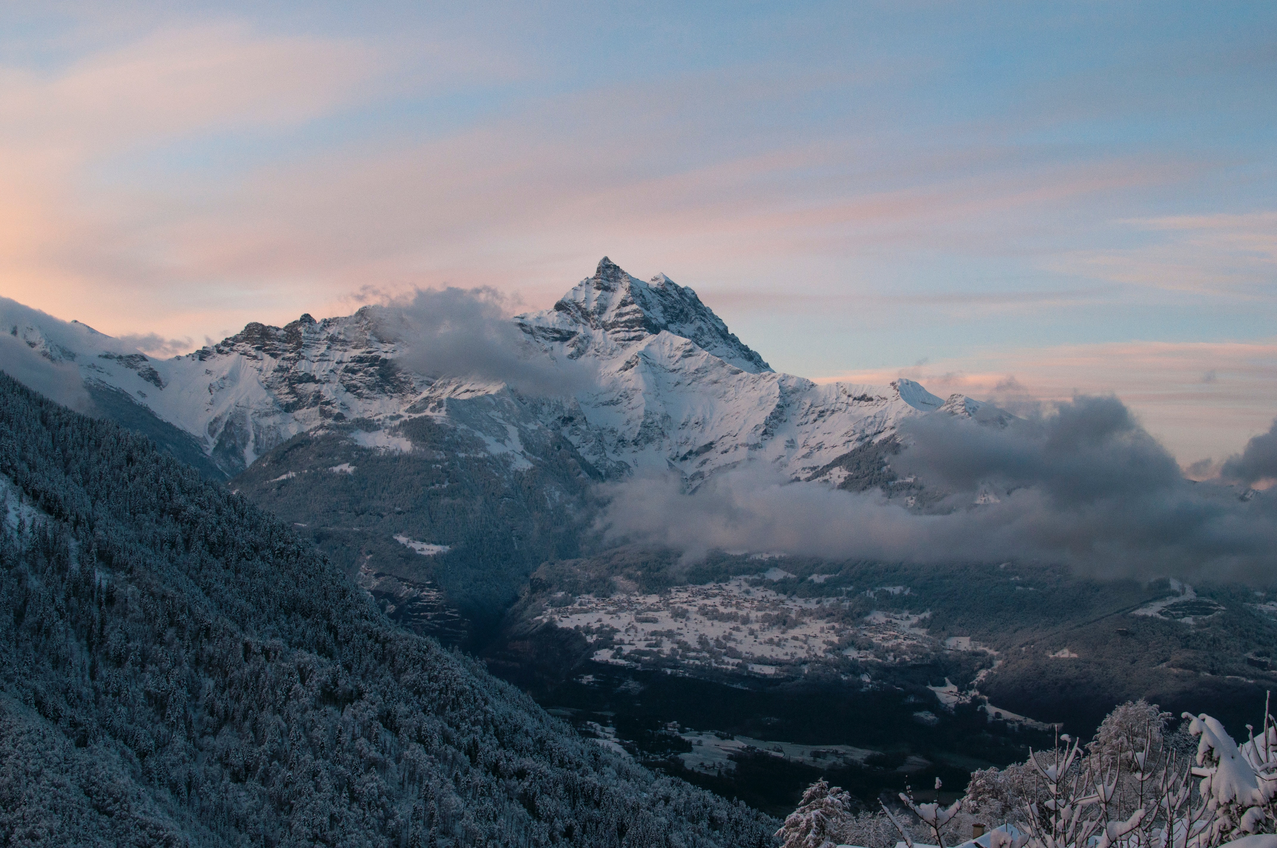 Snow-covered mountains in Switzerland at sunset HD Wallpaper