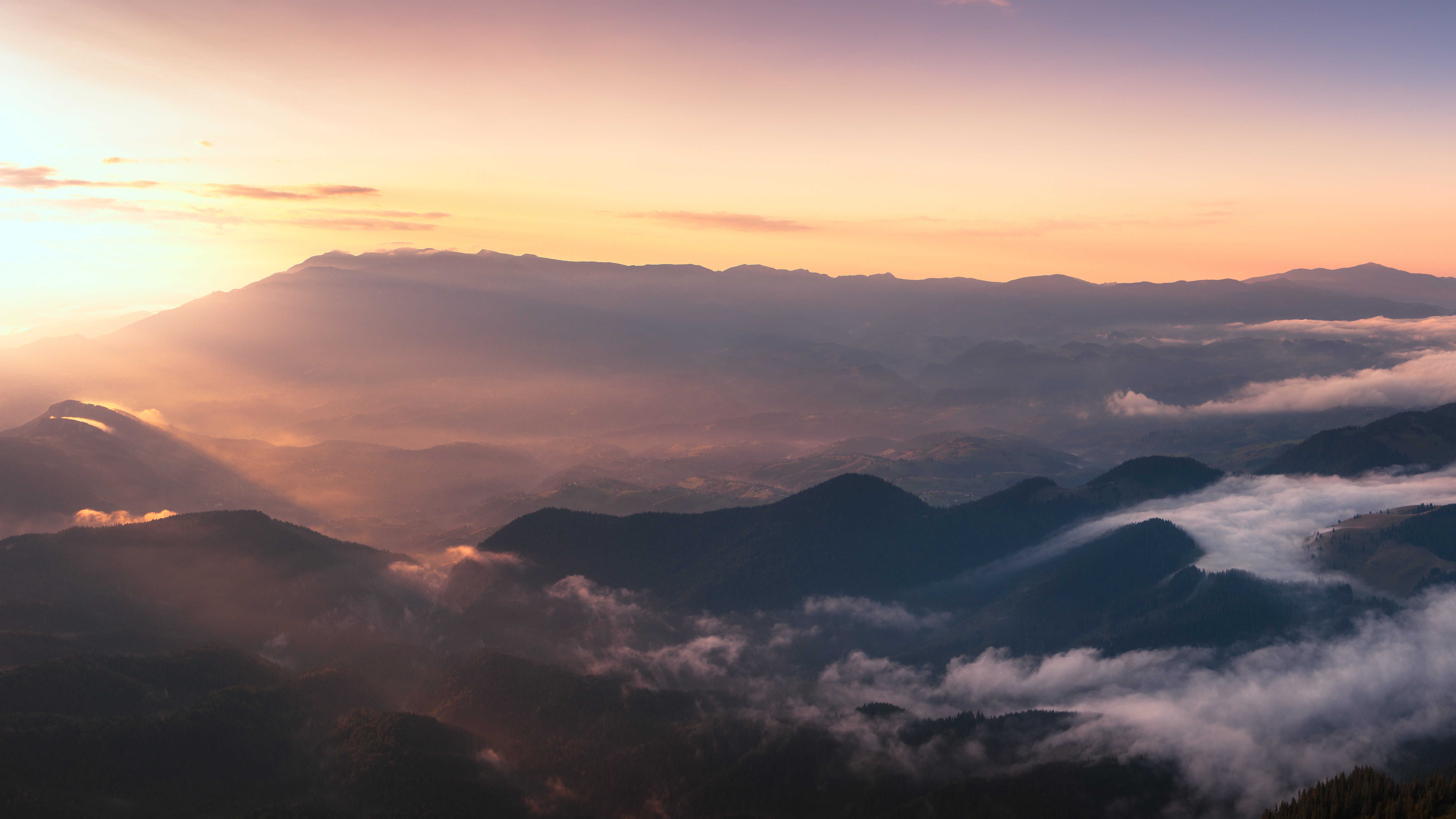 Sunrise over misty mountains in Romania HD Wallpaper