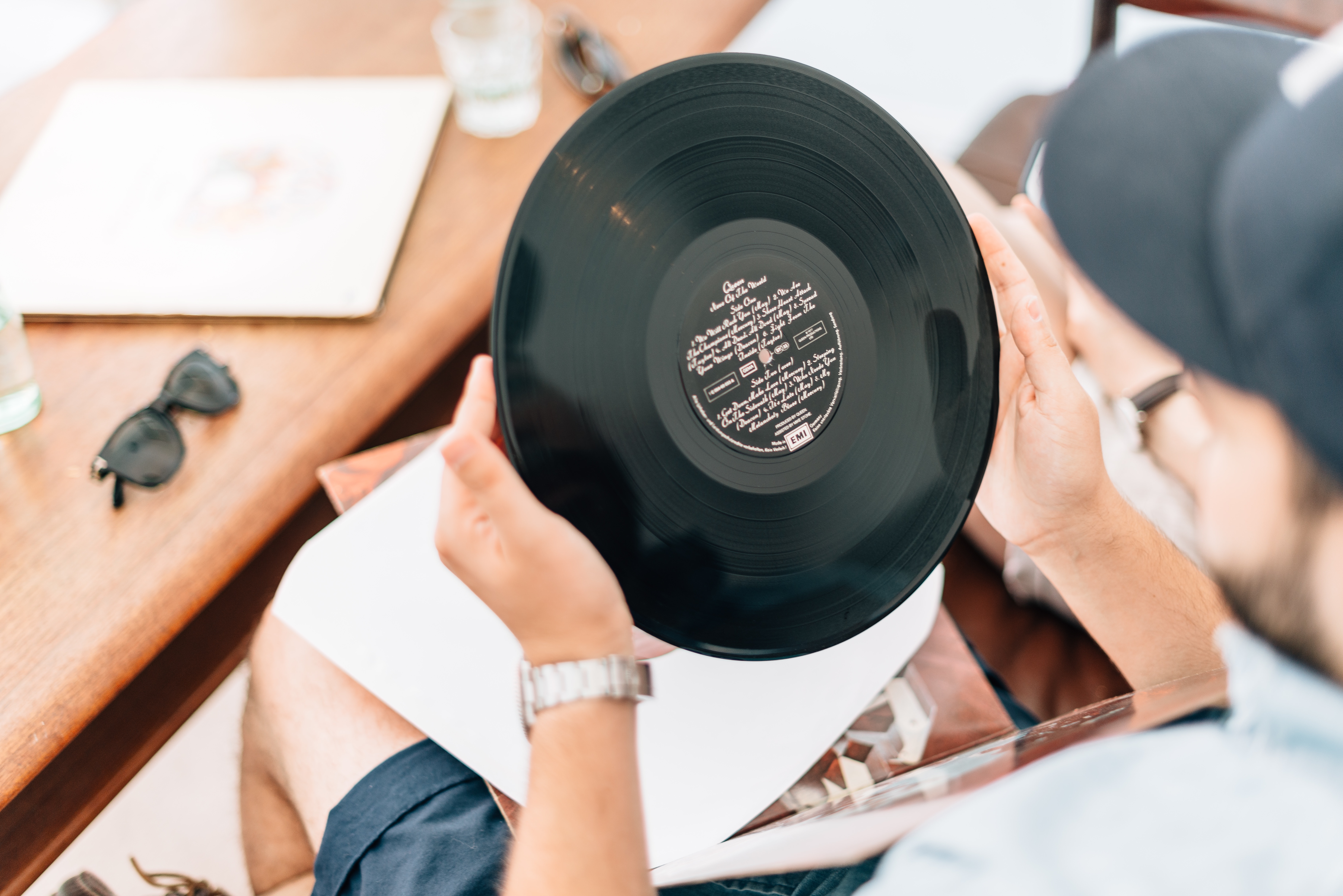Man holding a vinyl record HD Wallpaper