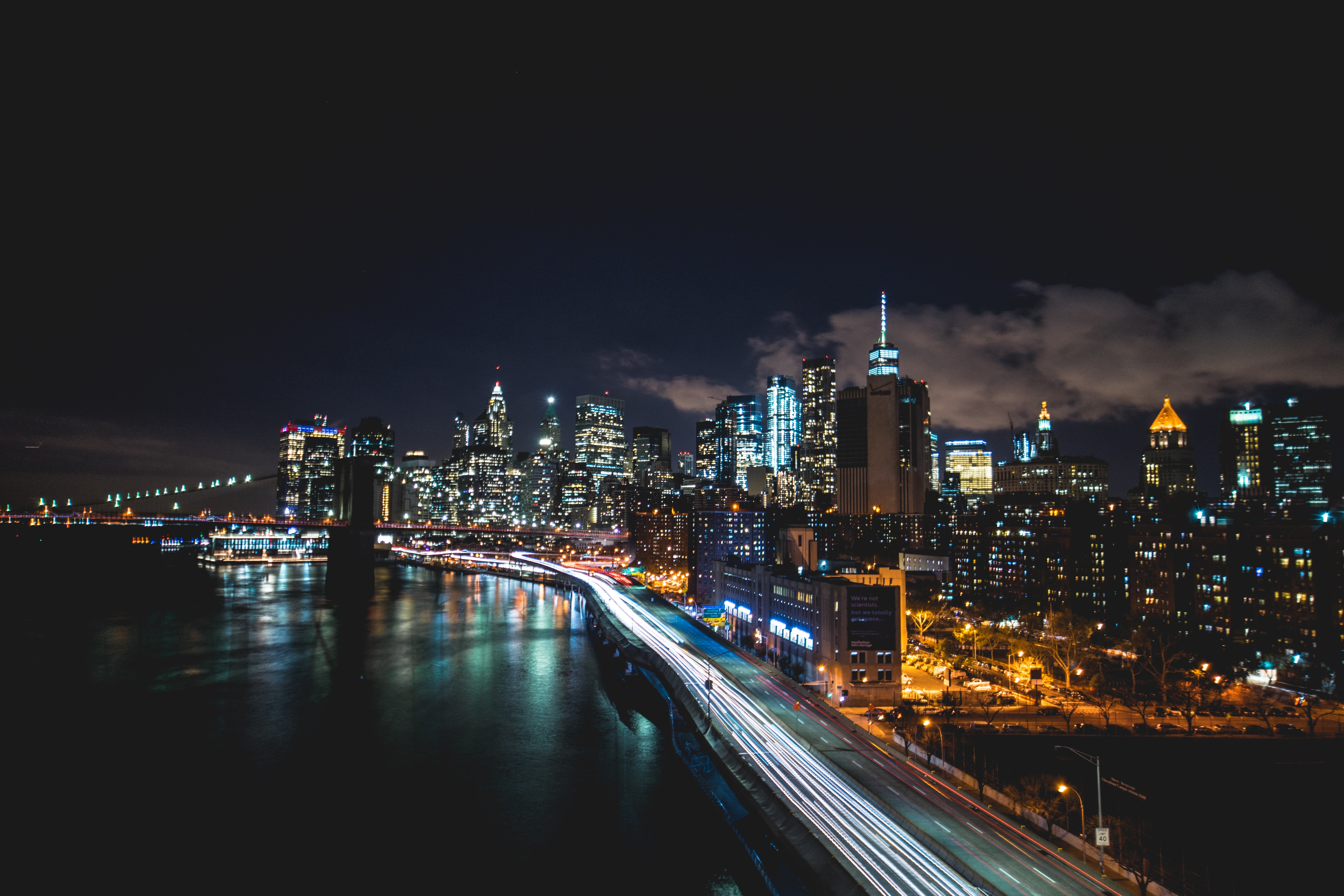 New York City skyline at night with Brooklyn Bridge HD Wallpaper