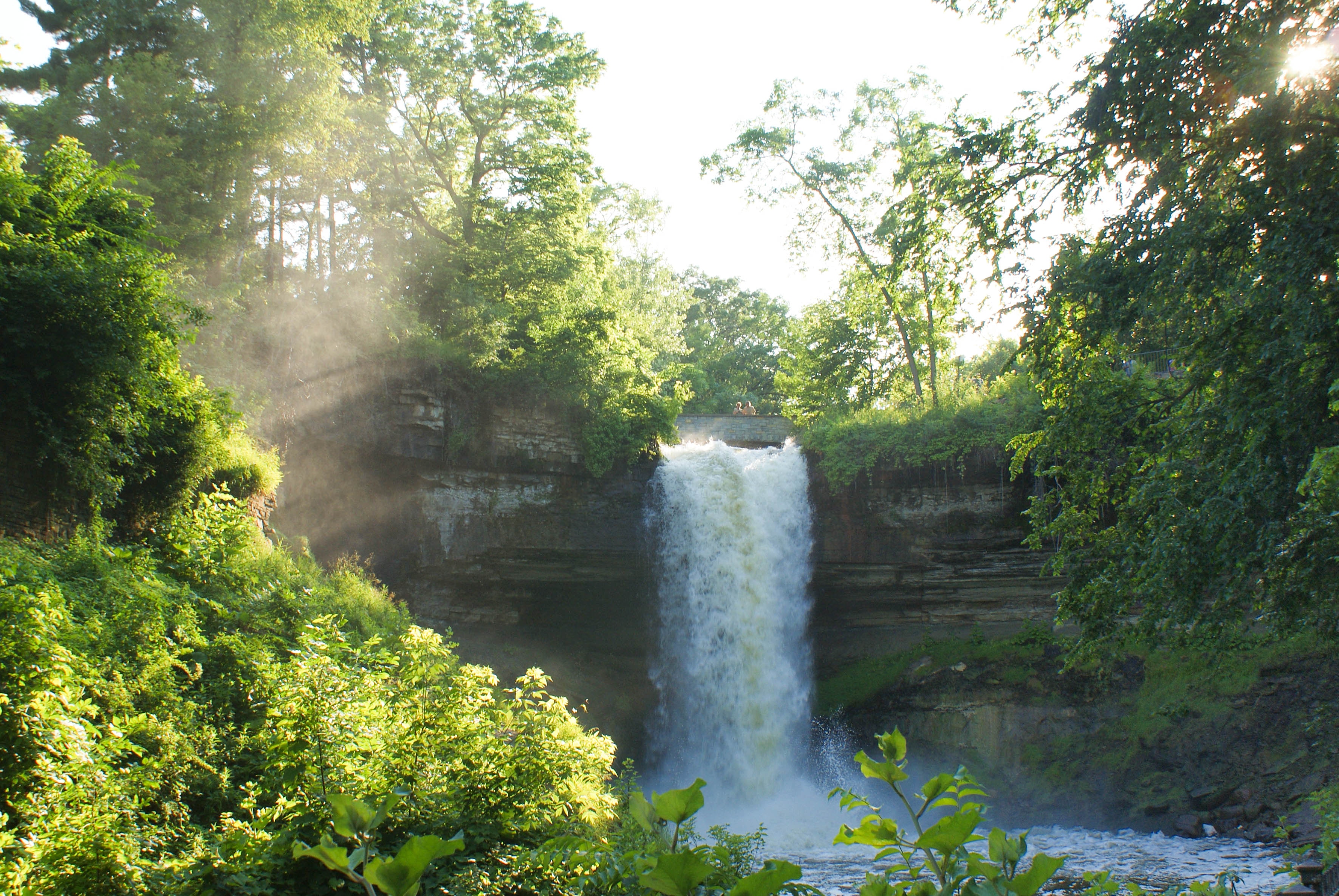 Minnehaha Falls in summer with sunlight and mist HD Wallpaper