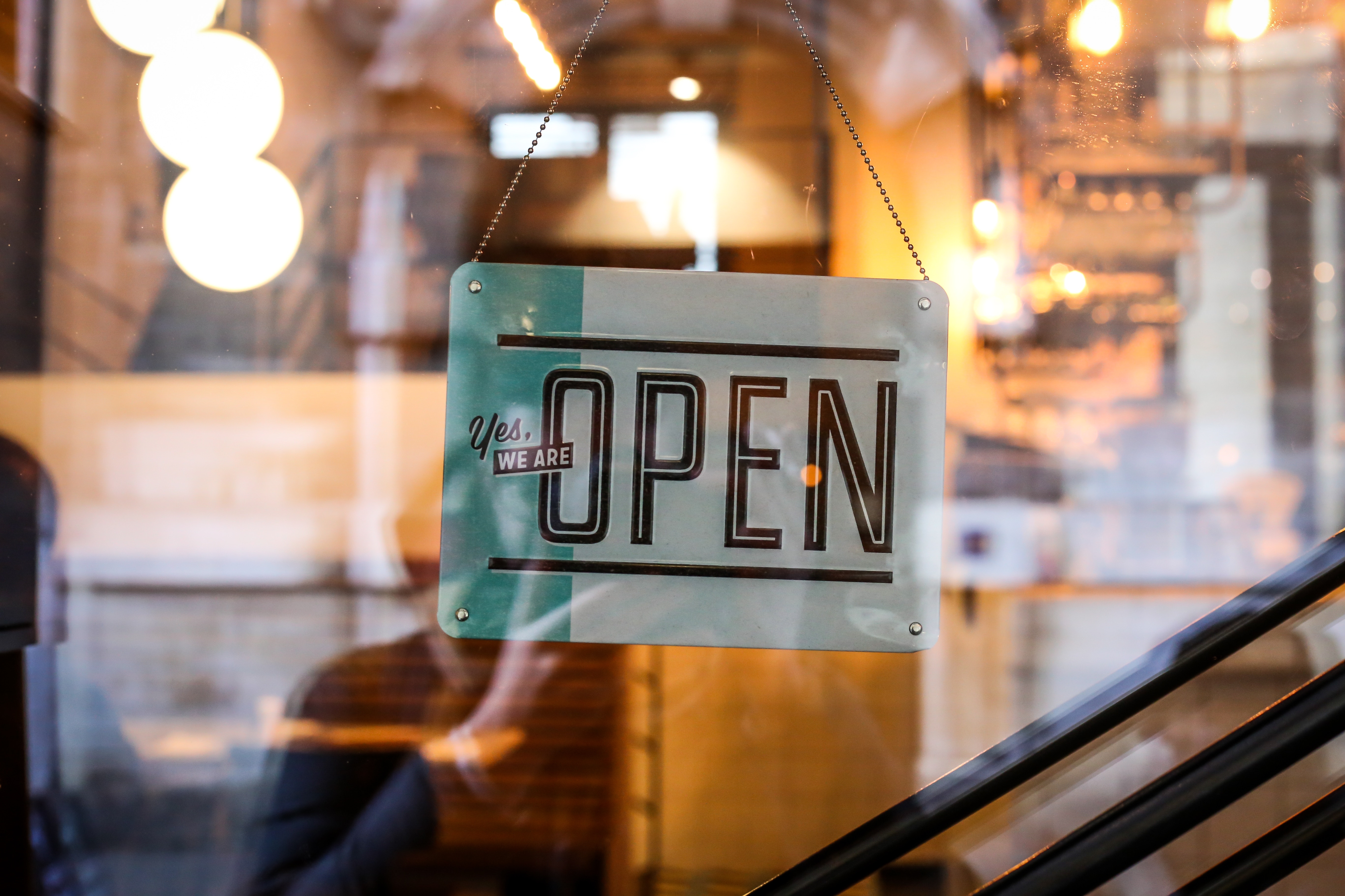 Open sign hanging on a shop window HD Wallpaper