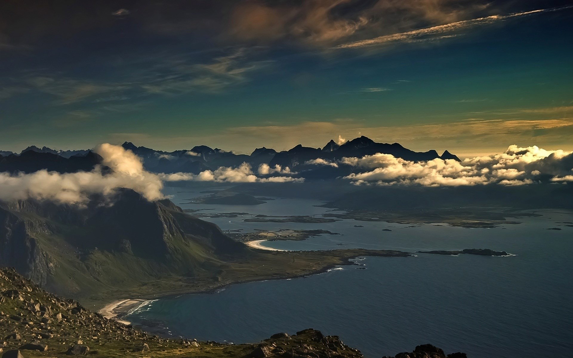 Mountainous coastline with clouds over the sea HD Wallpaper