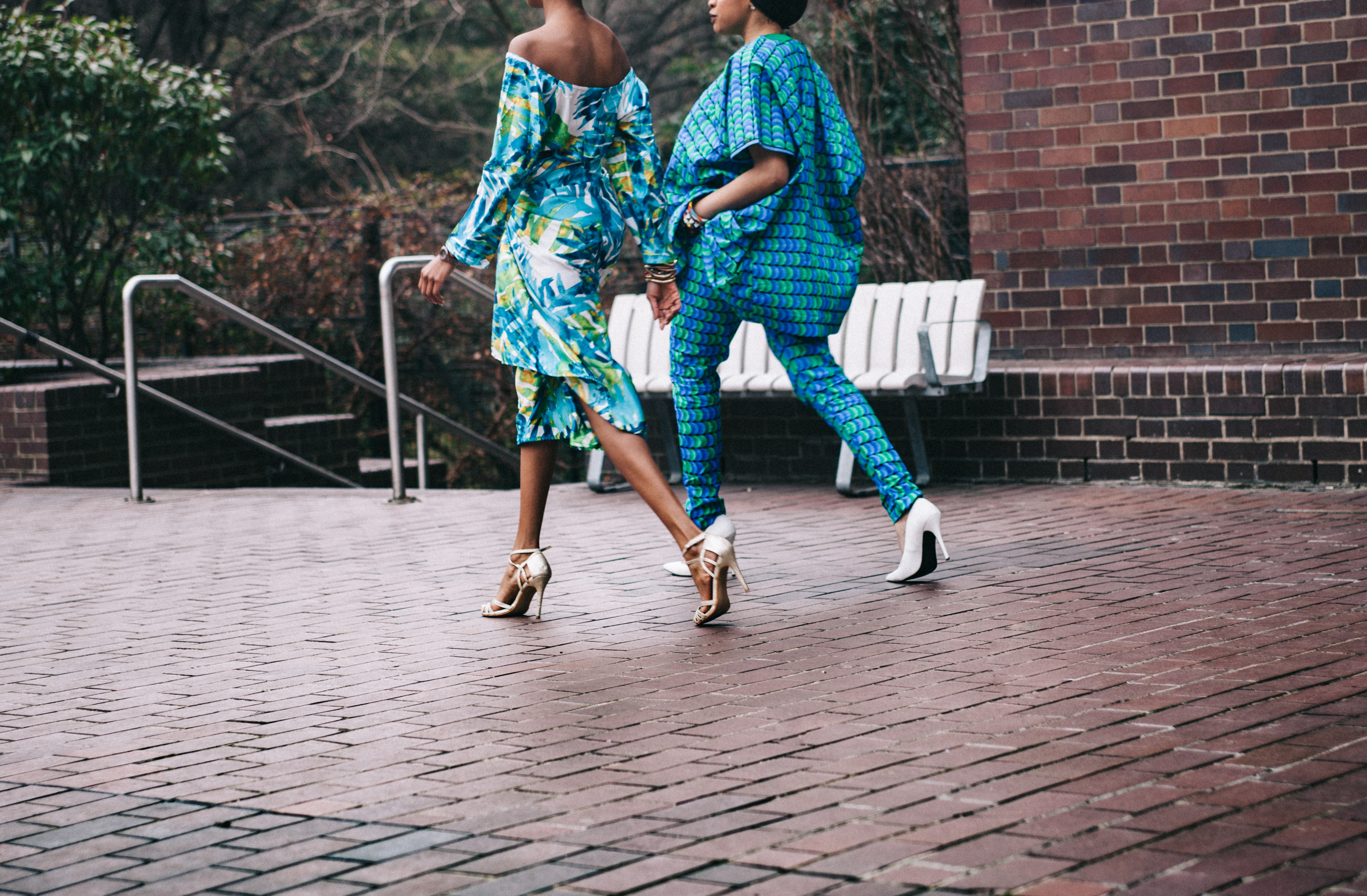 Two women in African print fashion walking HD Wallpaper