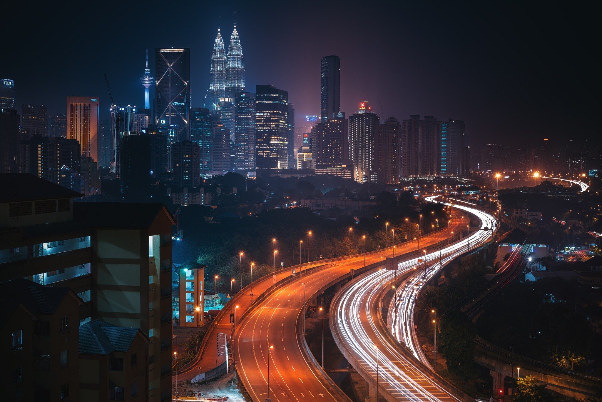 Night view of Kuala Lumpur city with highways HD Wallpaper