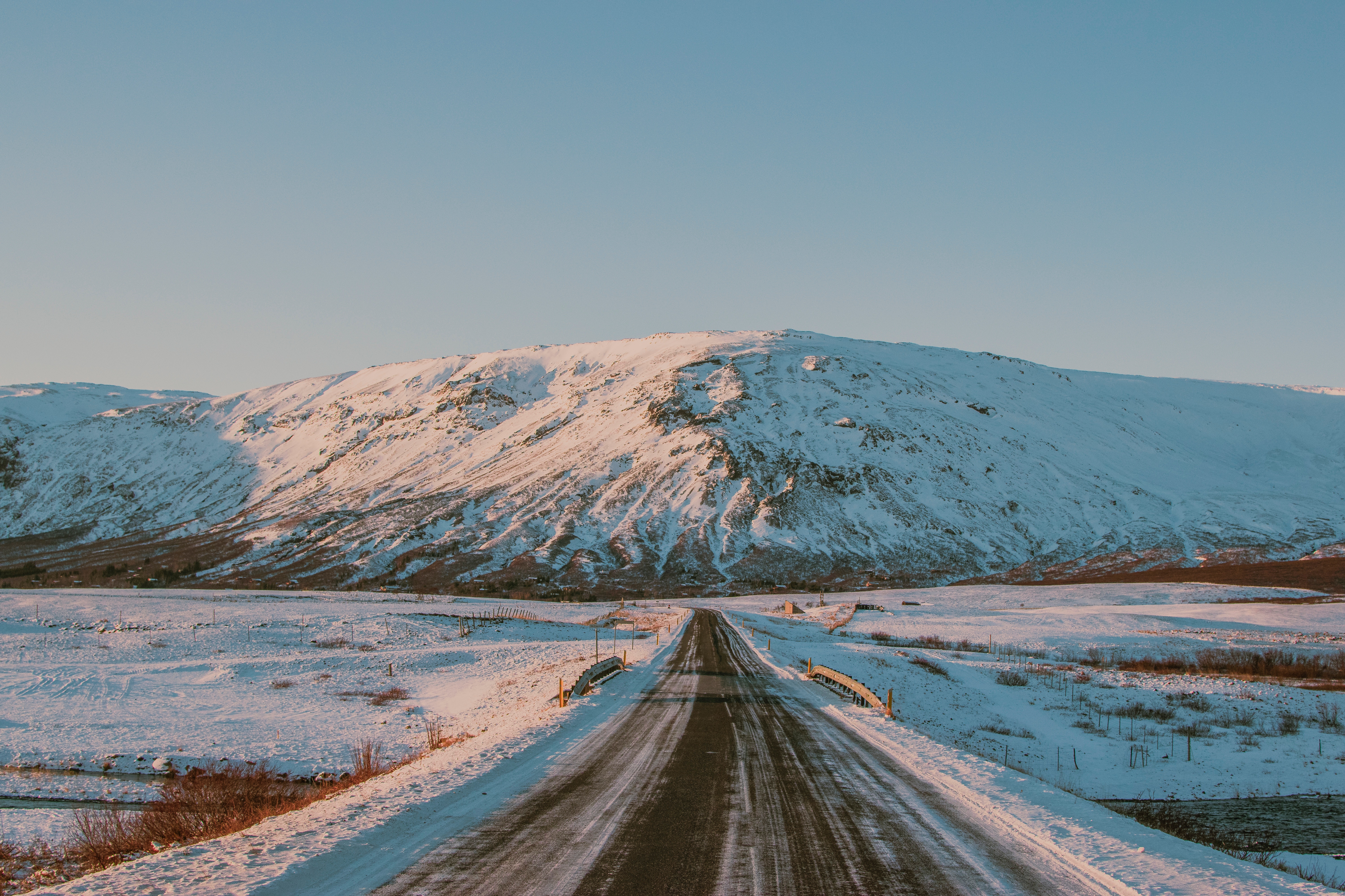Road through a snowy landscape in Iceland HD Wallpaper