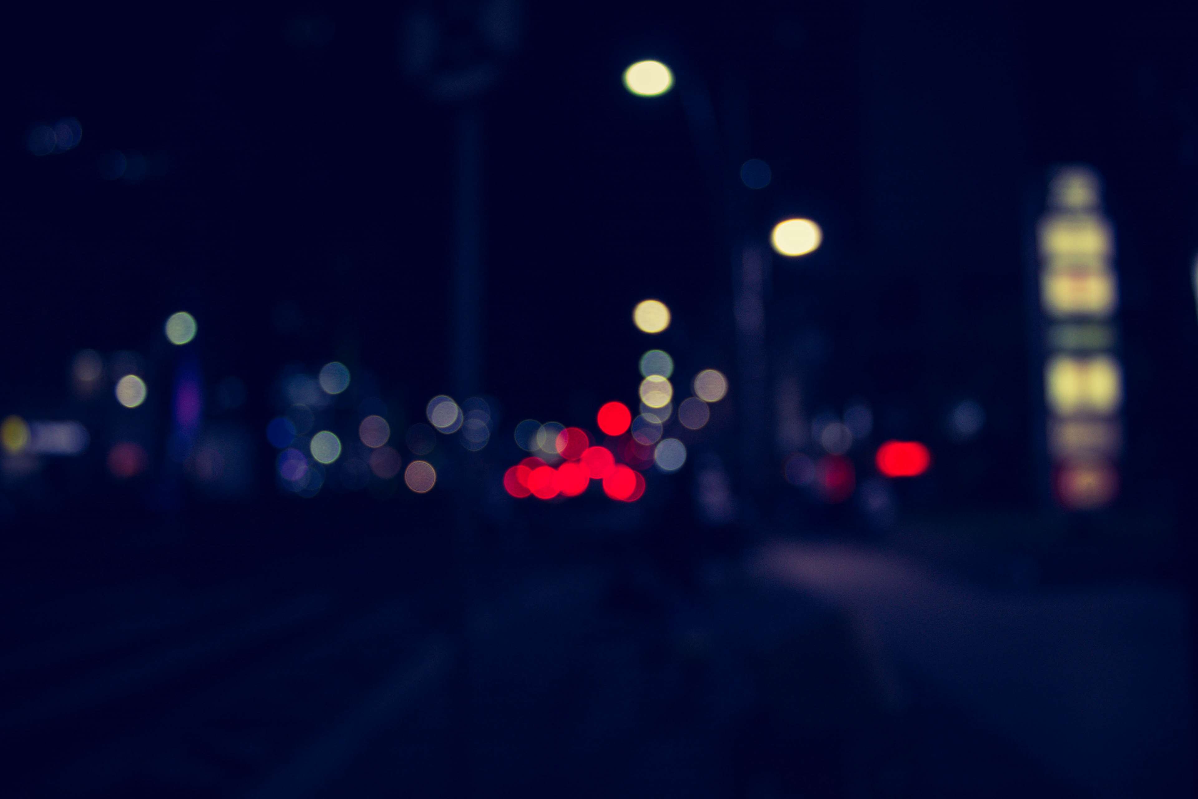Defocused street lights at night HD Wallpaper