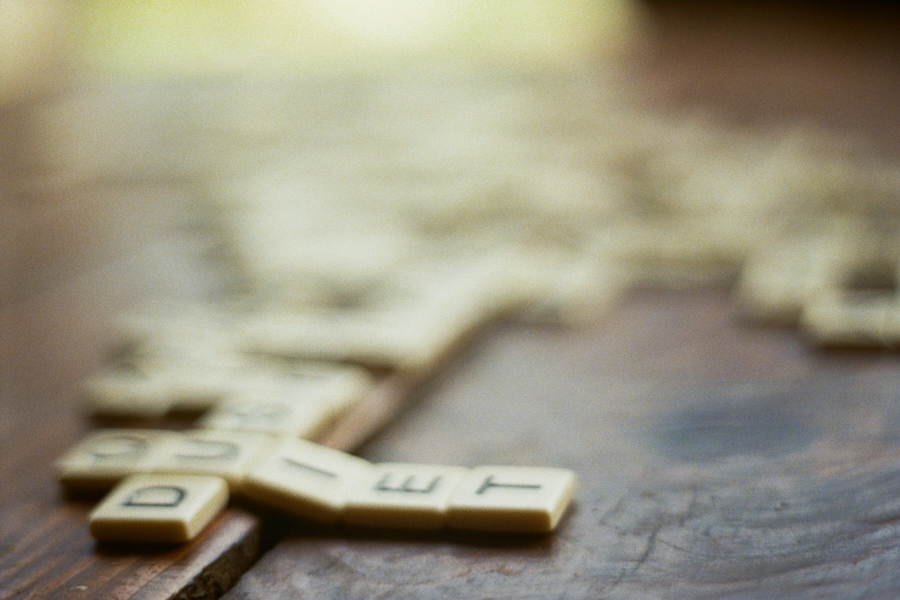 Scrabble tiles on a wooden table HD Wallpaper