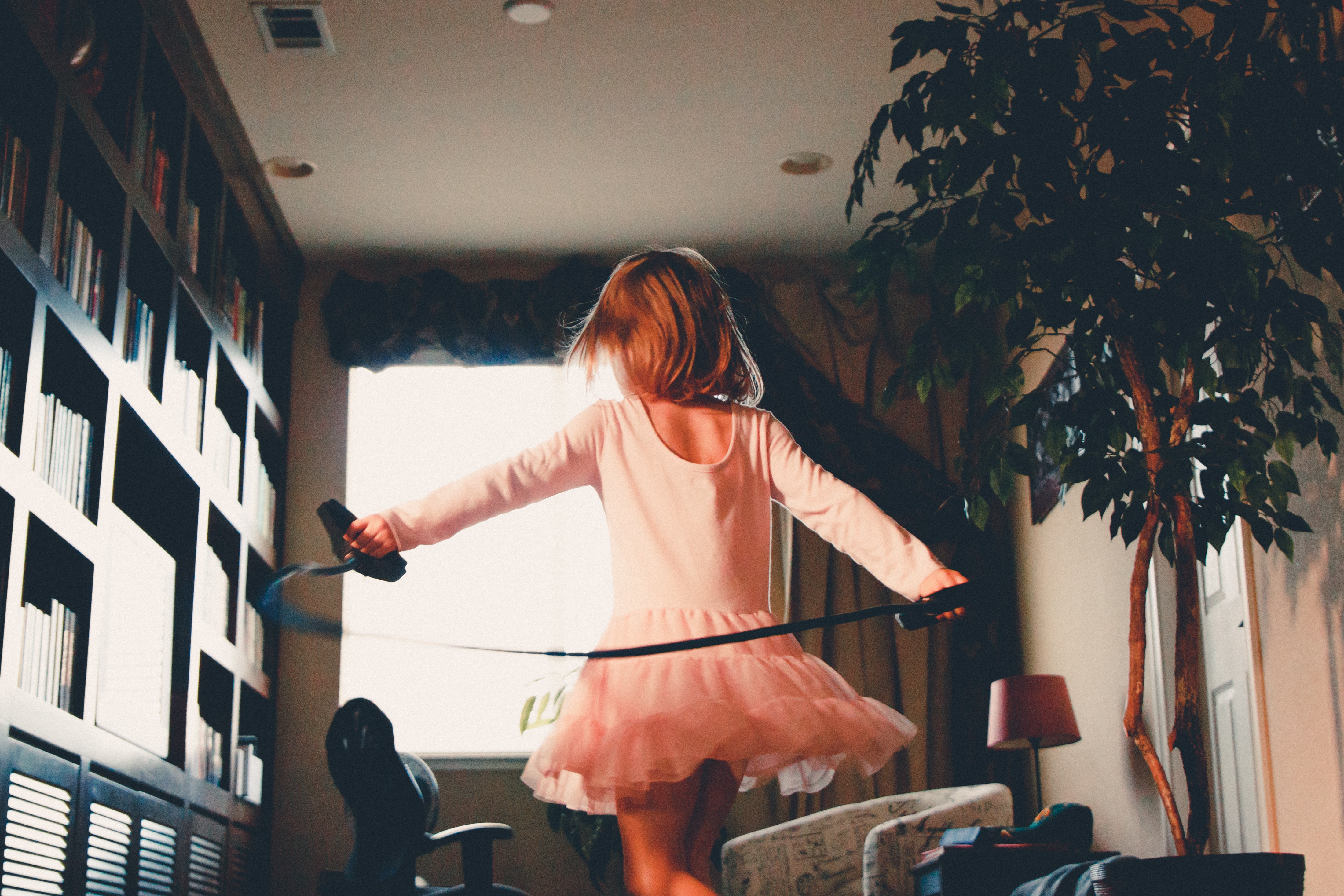 Girl in pink tutu spinning with a jump rope HD Wallpaper
