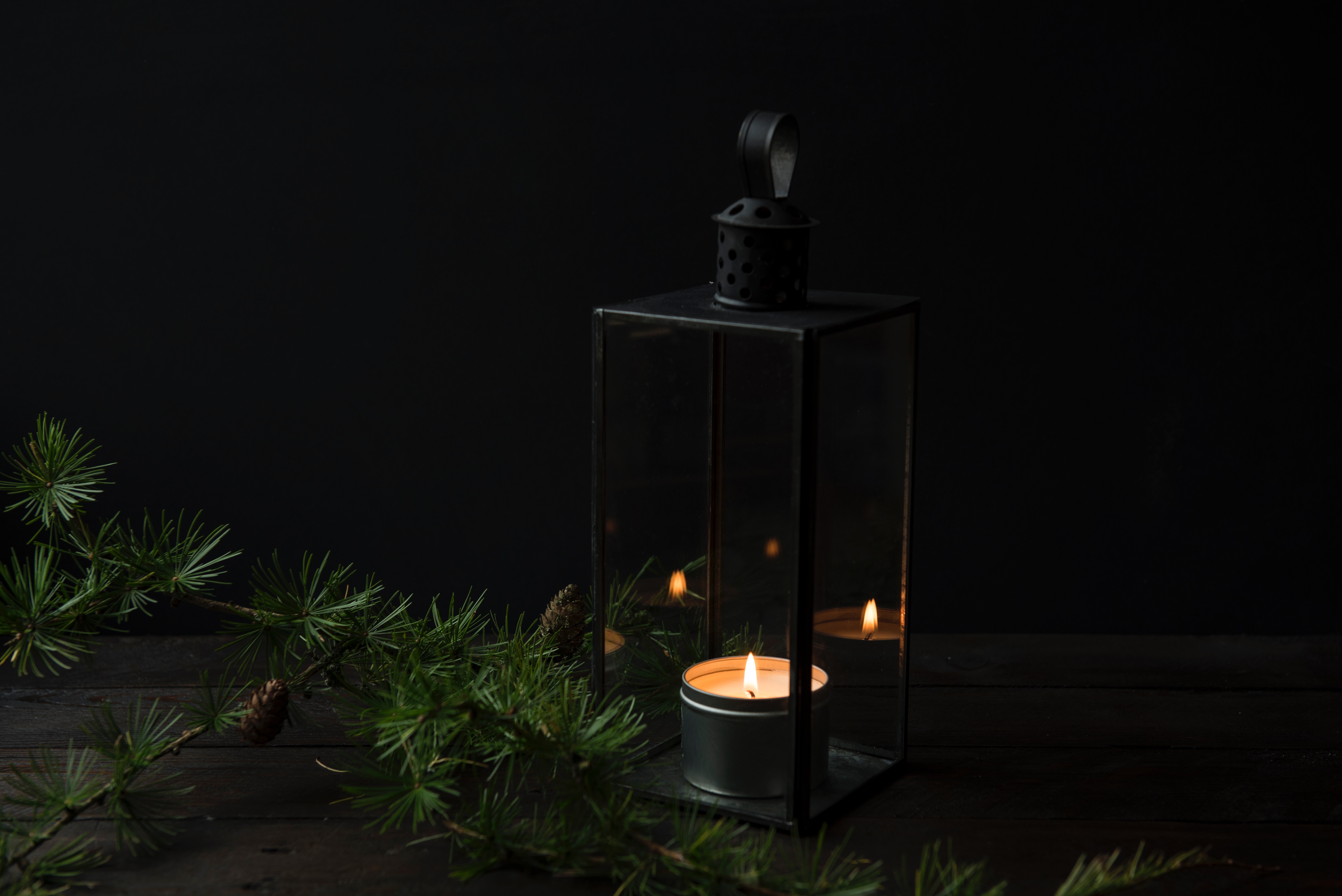 Lantern with a candle and pine branch HD Wallpaper