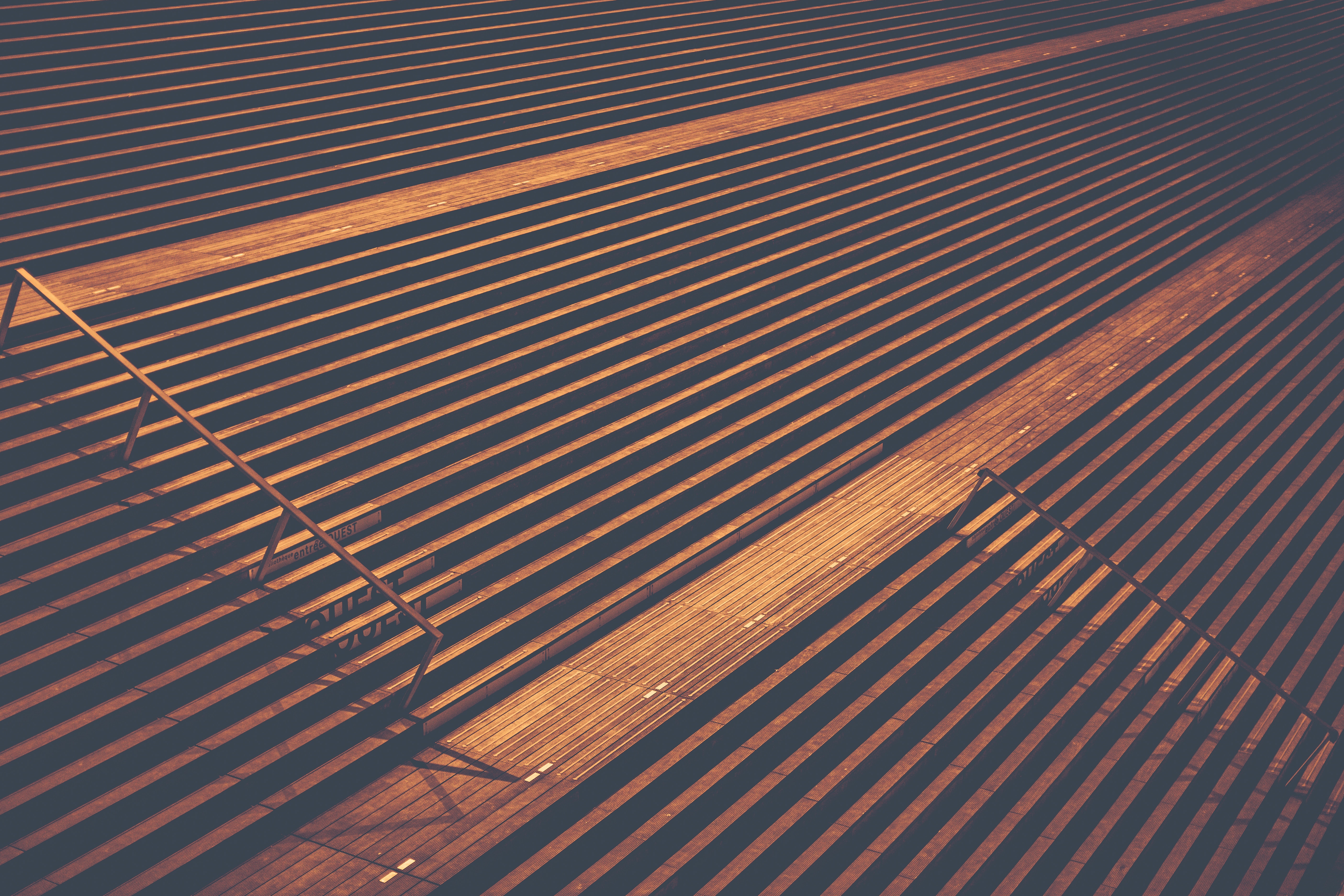 Golden stairs with shadows at night in Paris HD Wallpaper