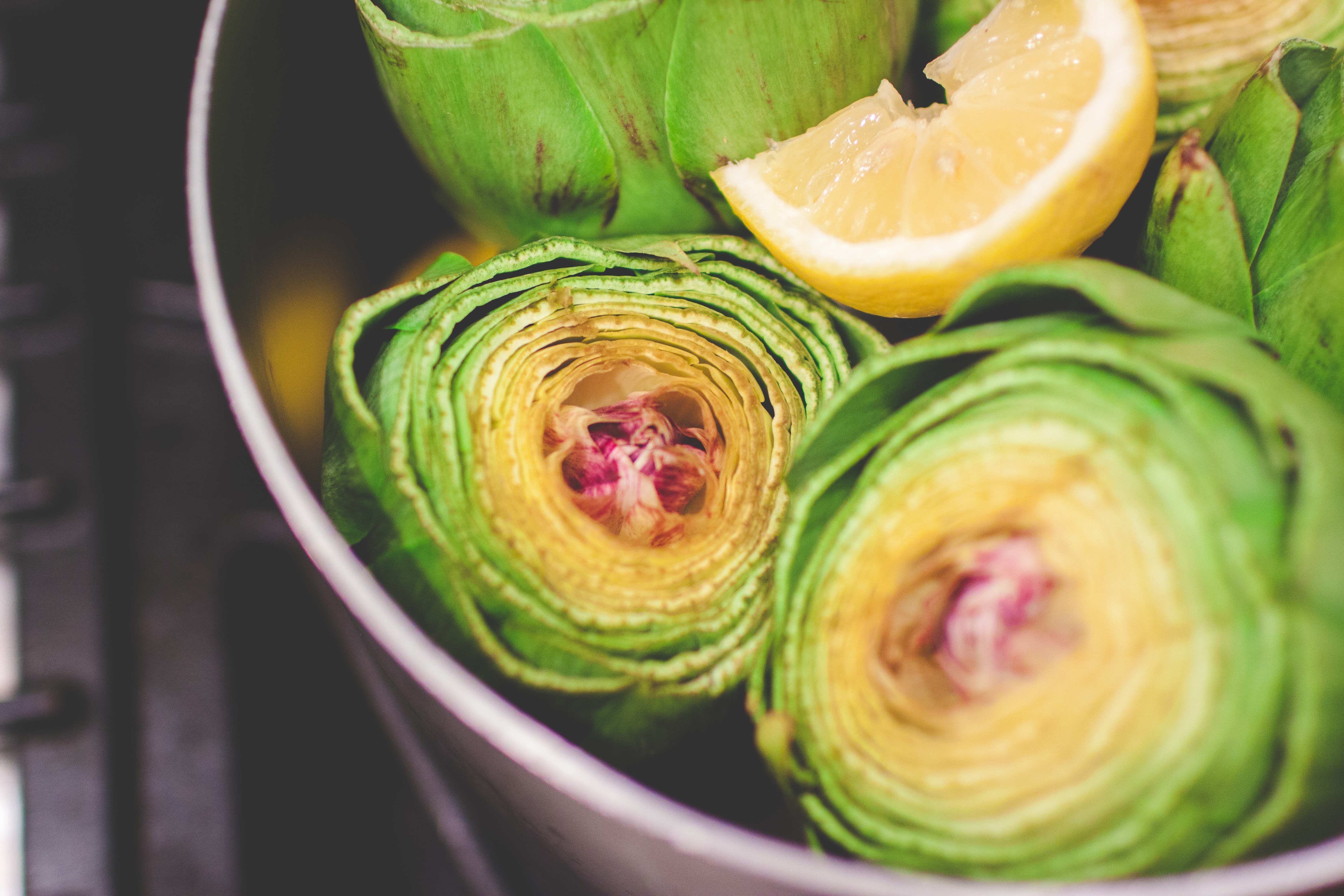 Artichokes and lemon in a pot HD Wallpaper