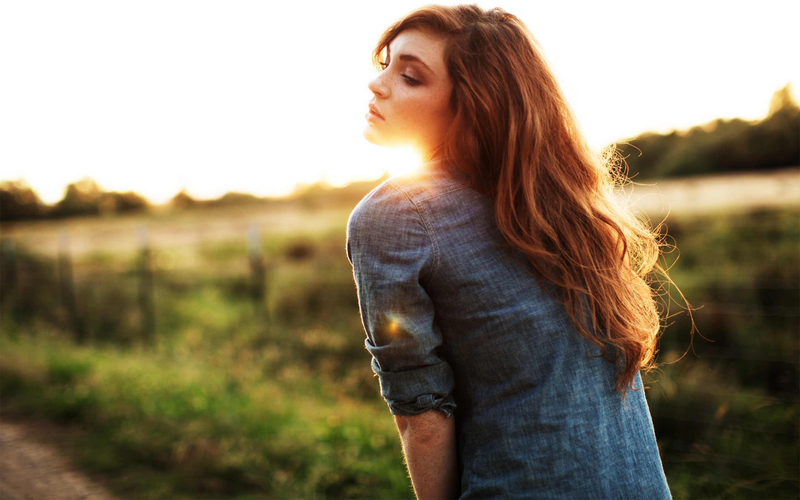 Redhead Woman Bathed in Warm Sunshine Outdoors HD Wallpaper