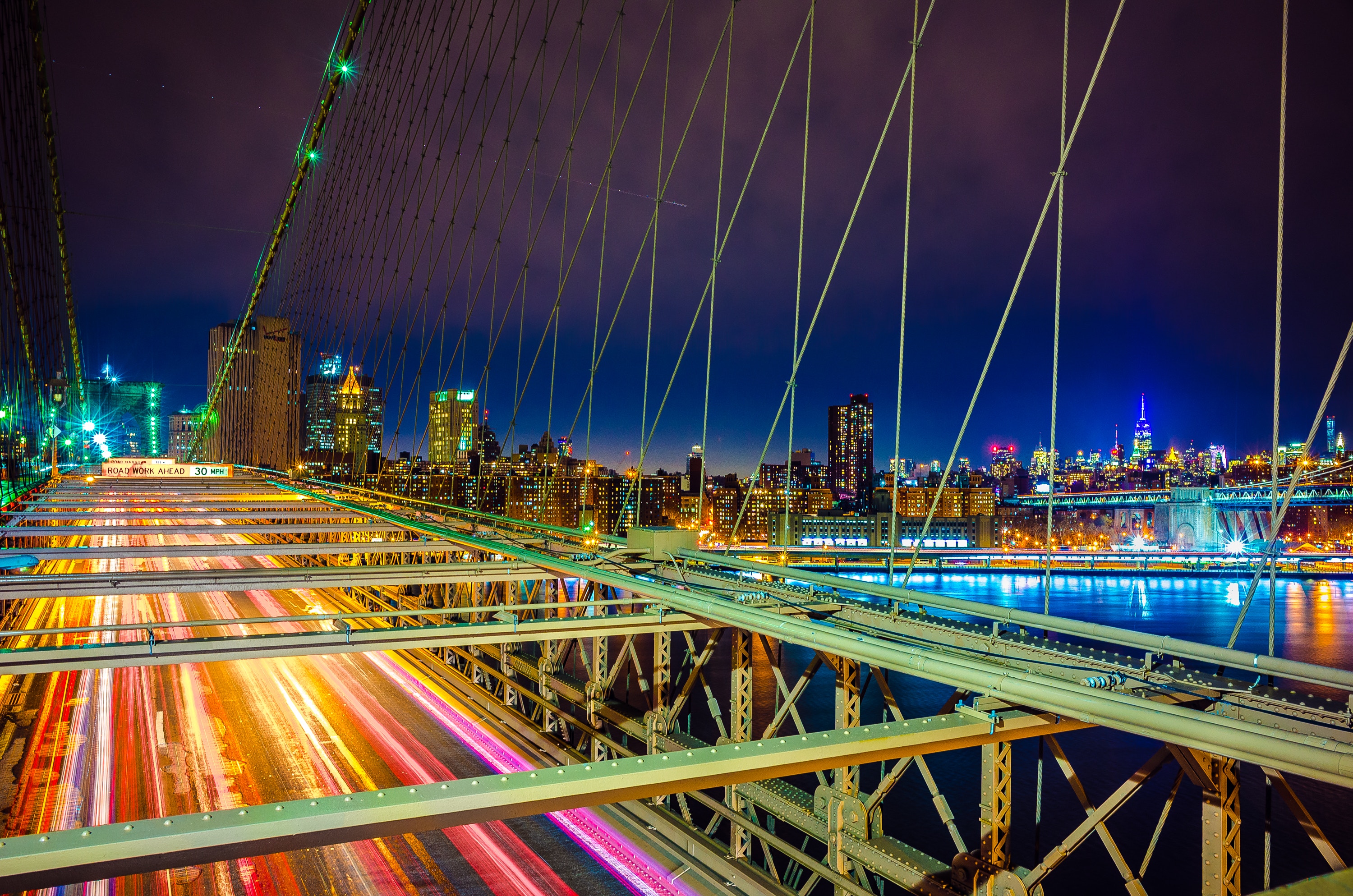 Brooklyn Bridge at night with New York City skyline HD Wallpaper