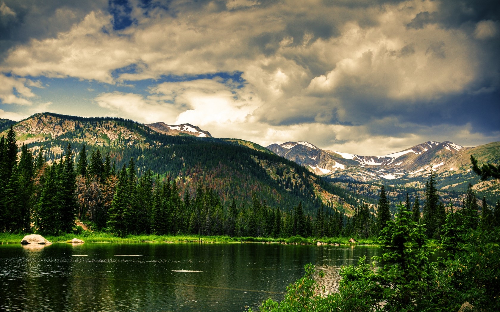 Mountains and lake with coniferous forest HD Wallpaper