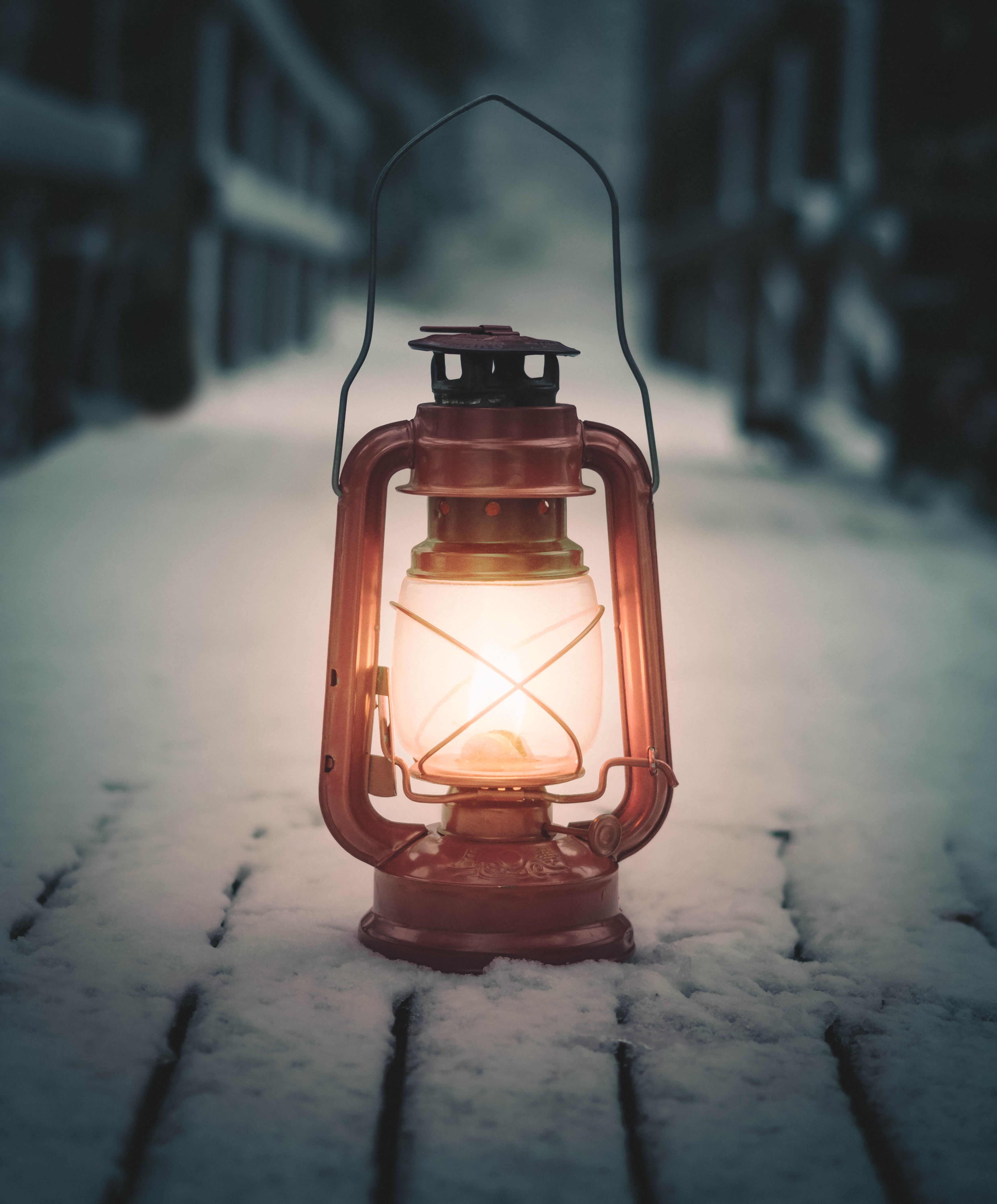 Lit lantern in the snow HD Wallpaper
