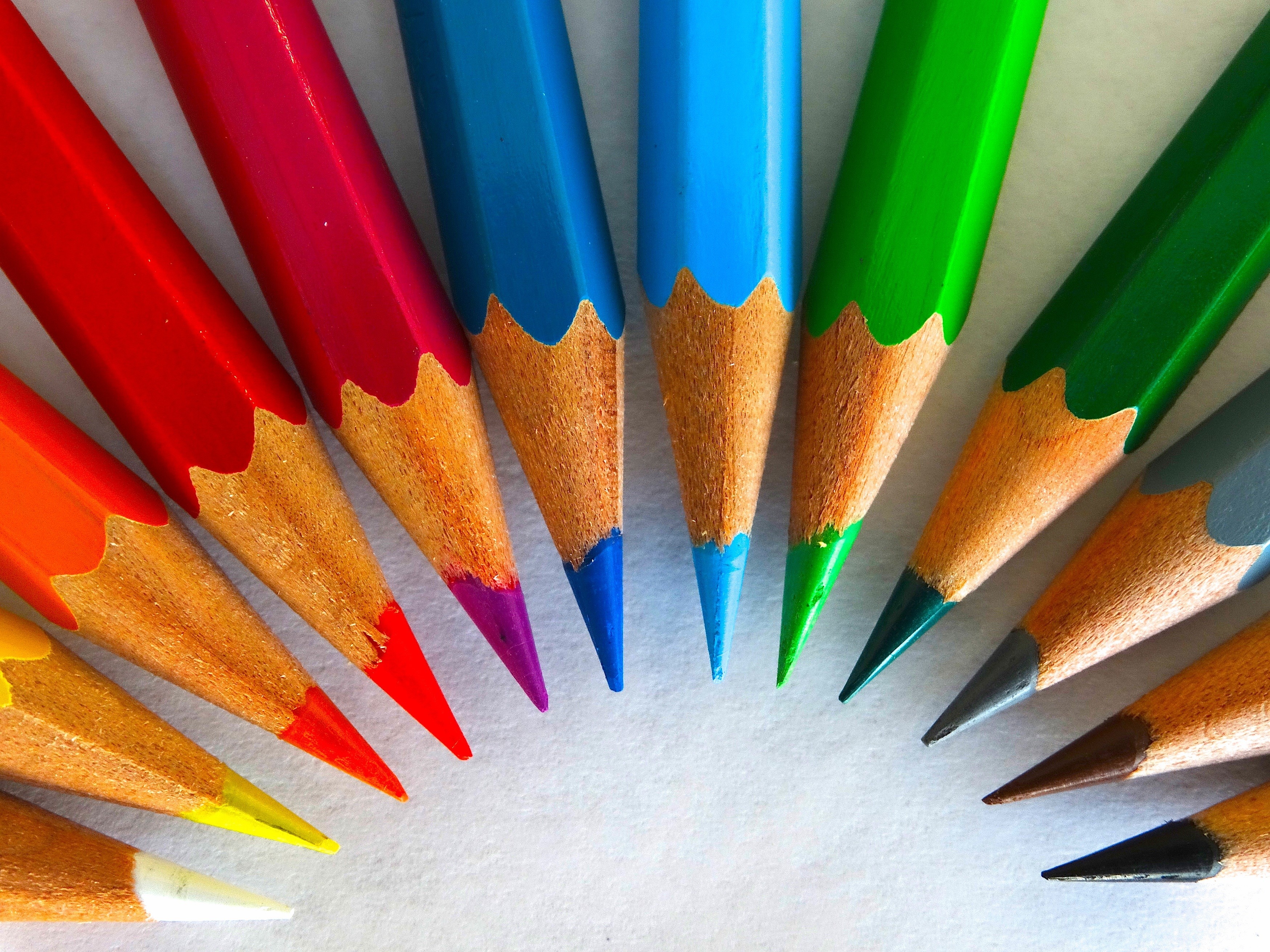 Close-up of sharpened colored pencils arranged in a fan shape HD Wallpaper