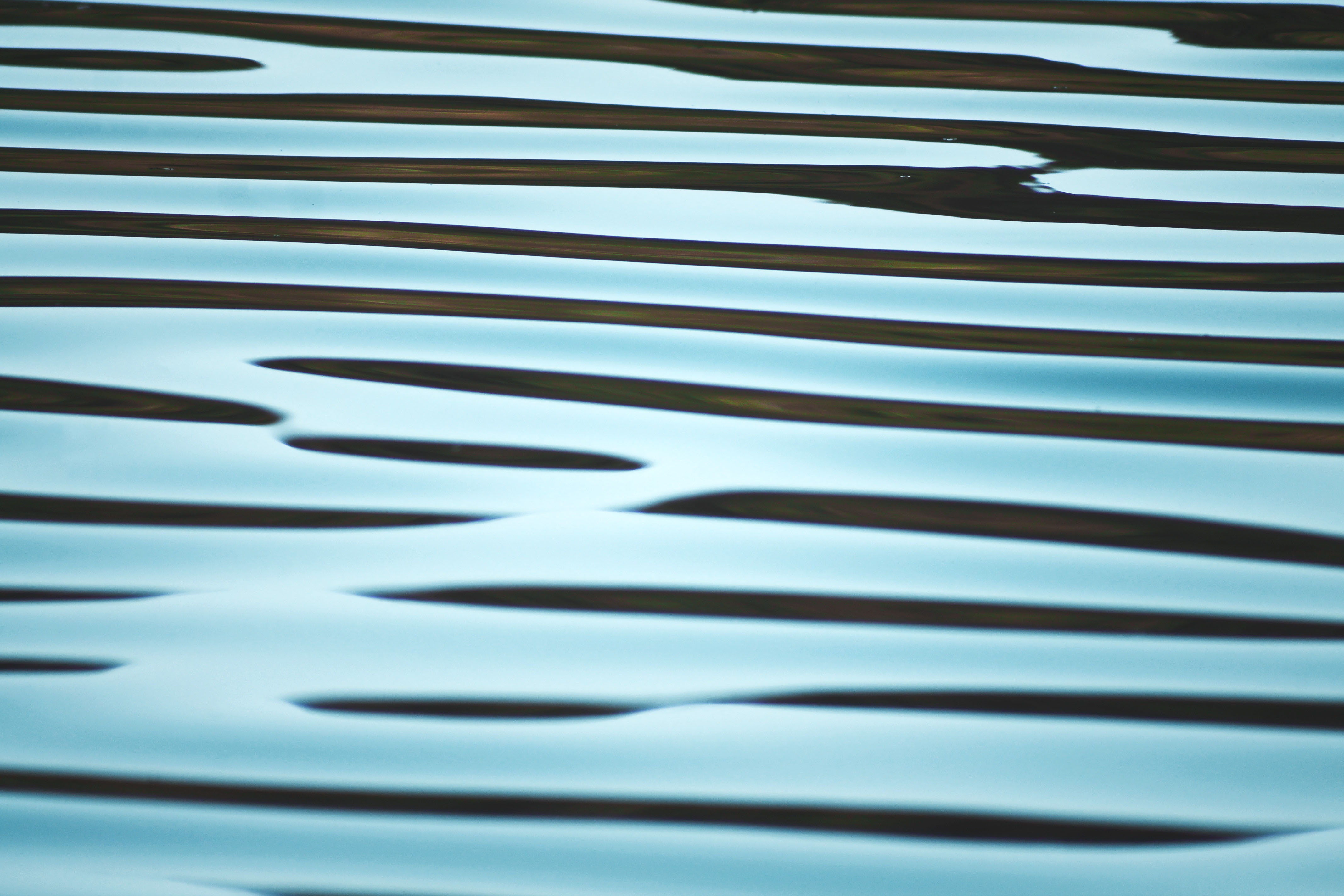 Abstract wavy blue water surface with dark lines HD Wallpaper
