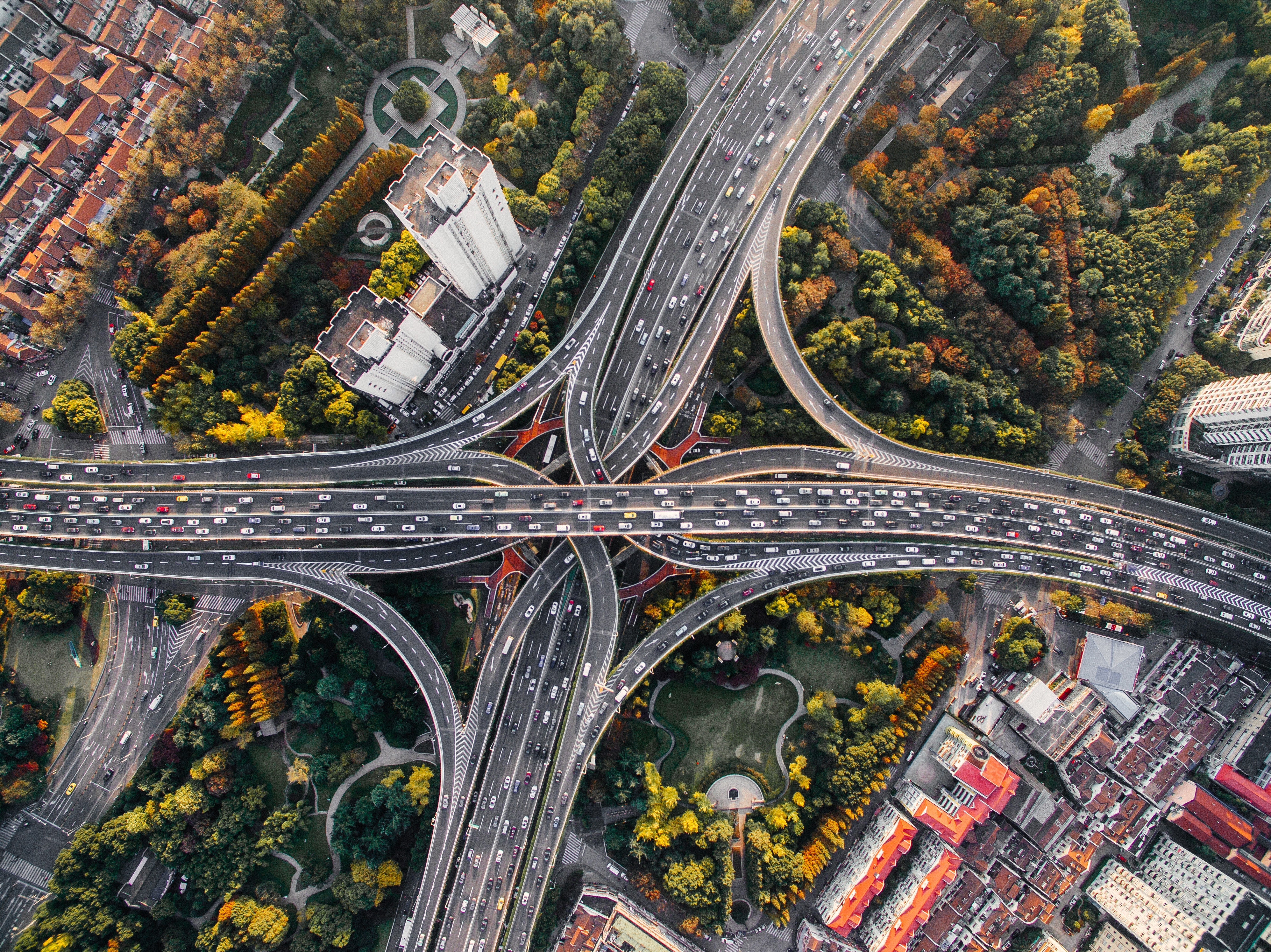 Aerial View of Busy Urban Highway Interchange HD Wallpaper