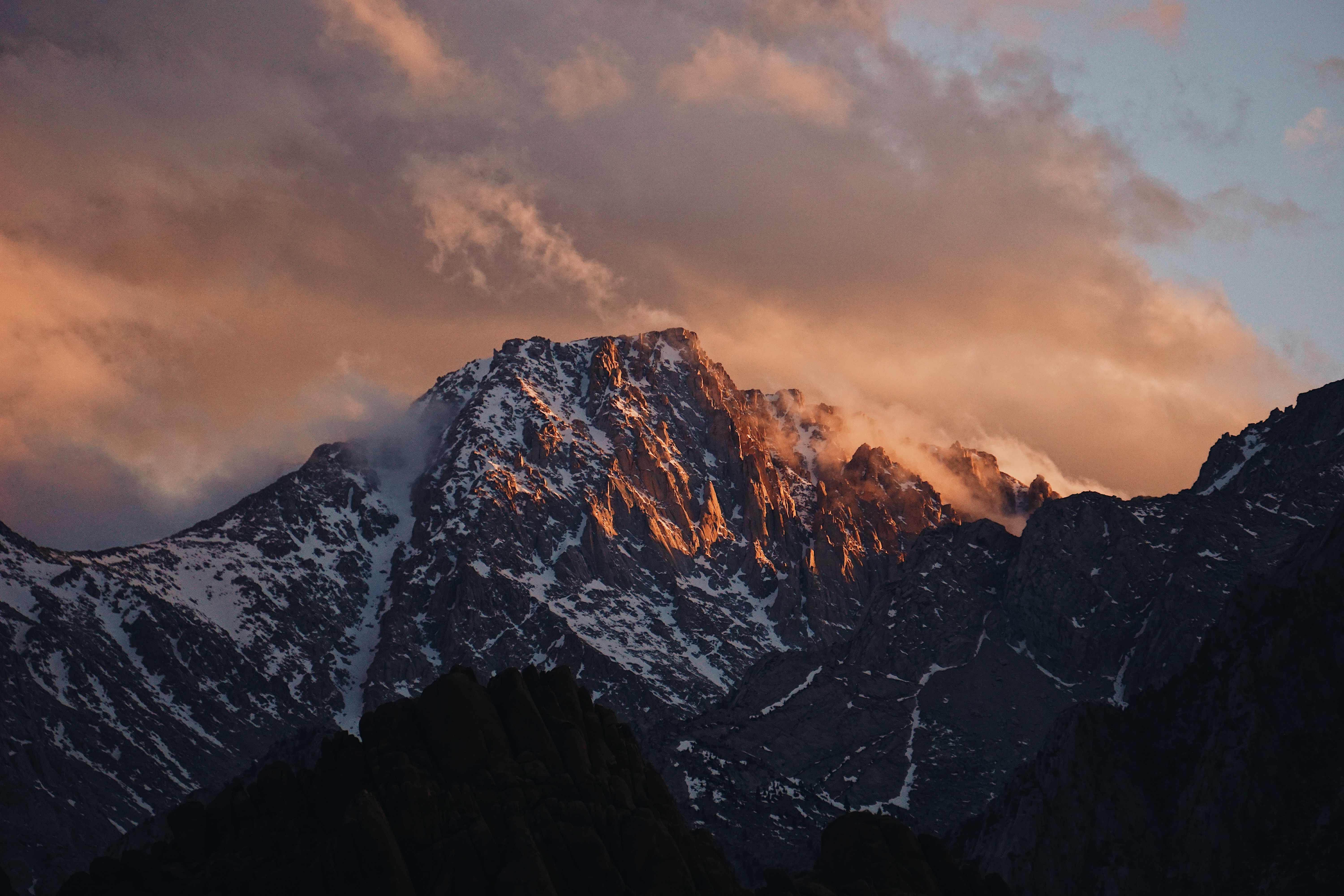 Snow-capped mountains at sunset with clouds HD Wallpaper