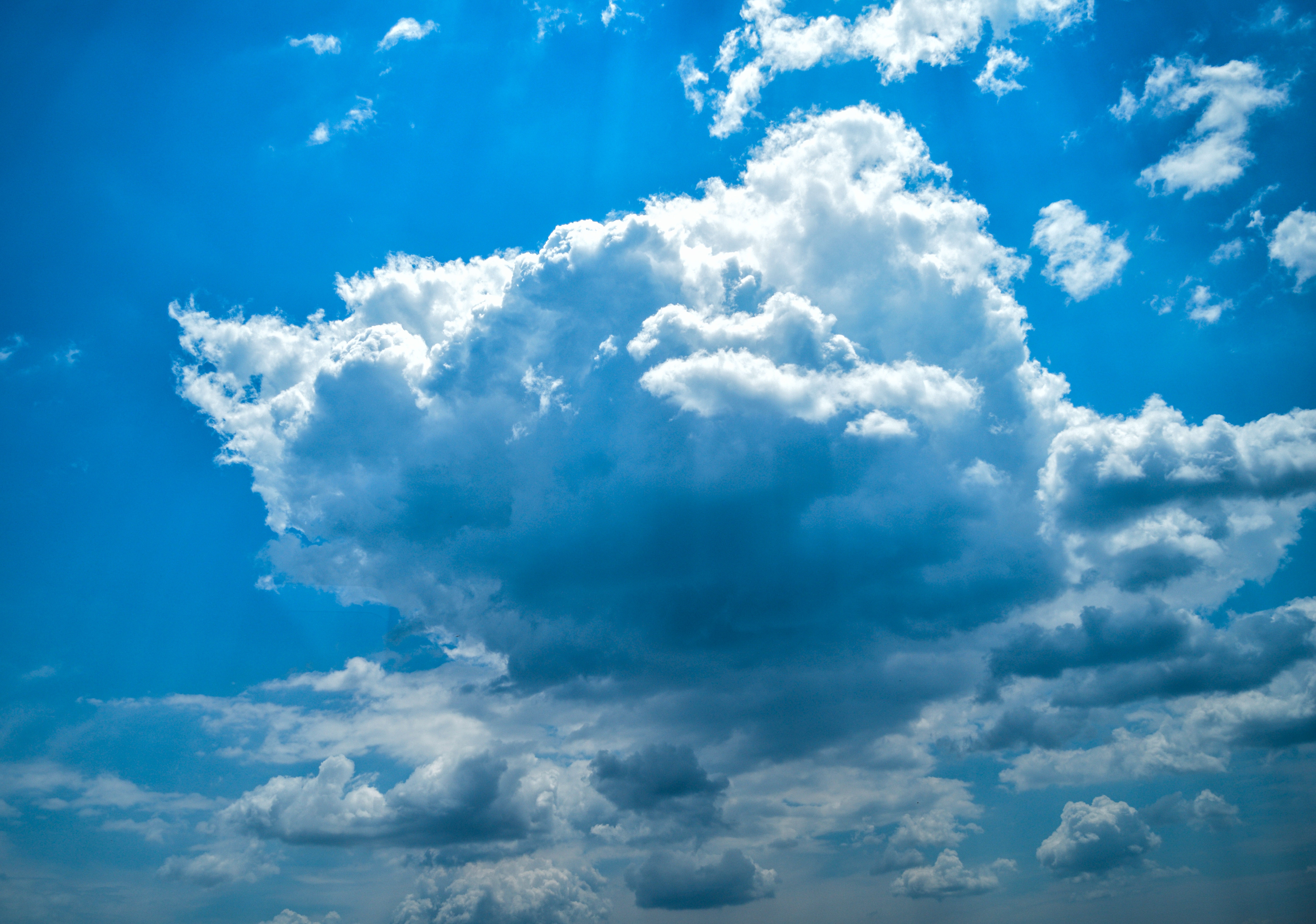 Blue sky with white and dark clouds HD Wallpaper
