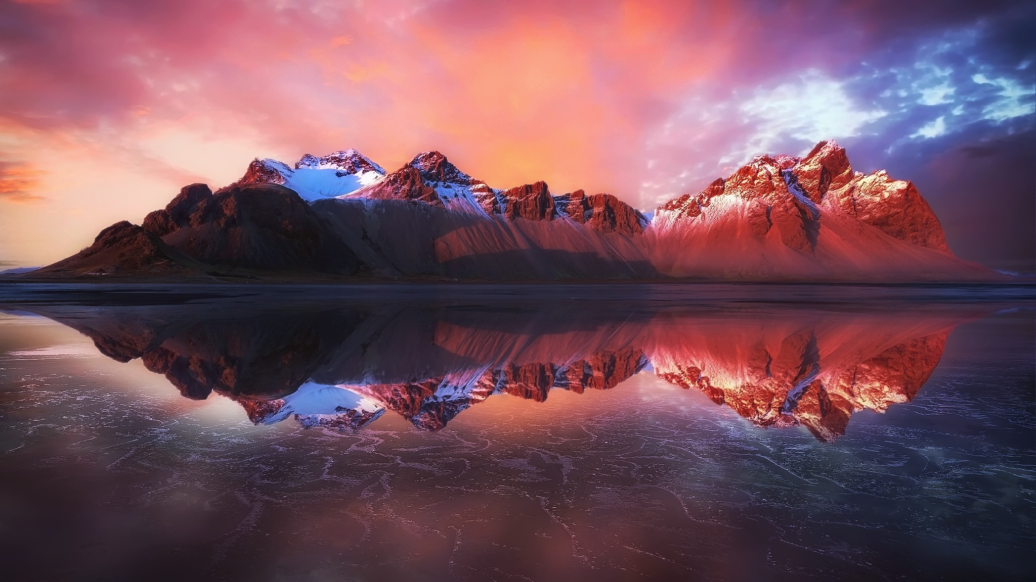 Mountains reflecting in water at sunset HD Wallpaper