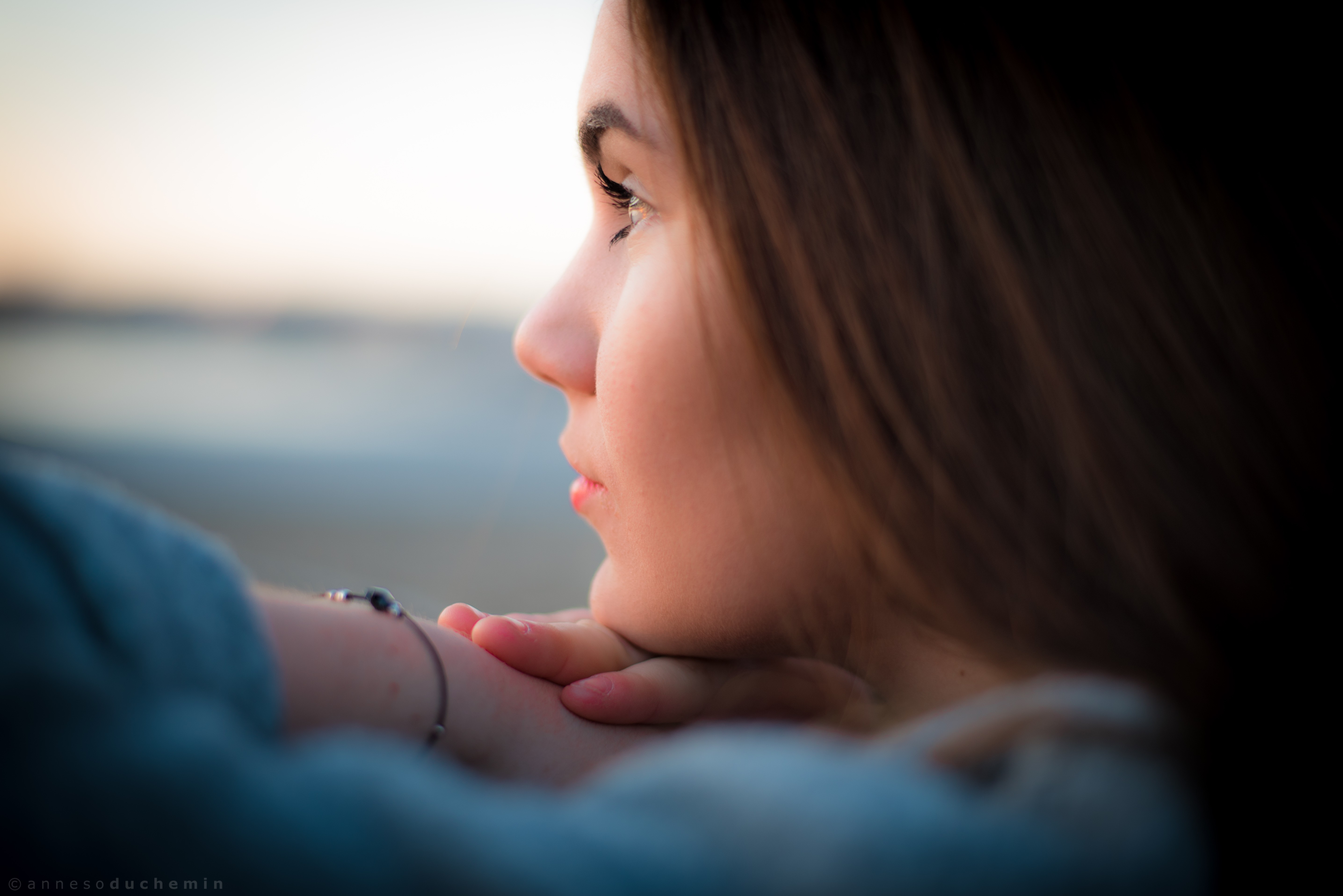 Close-up portrait of a young woman outdoors HD Wallpaper