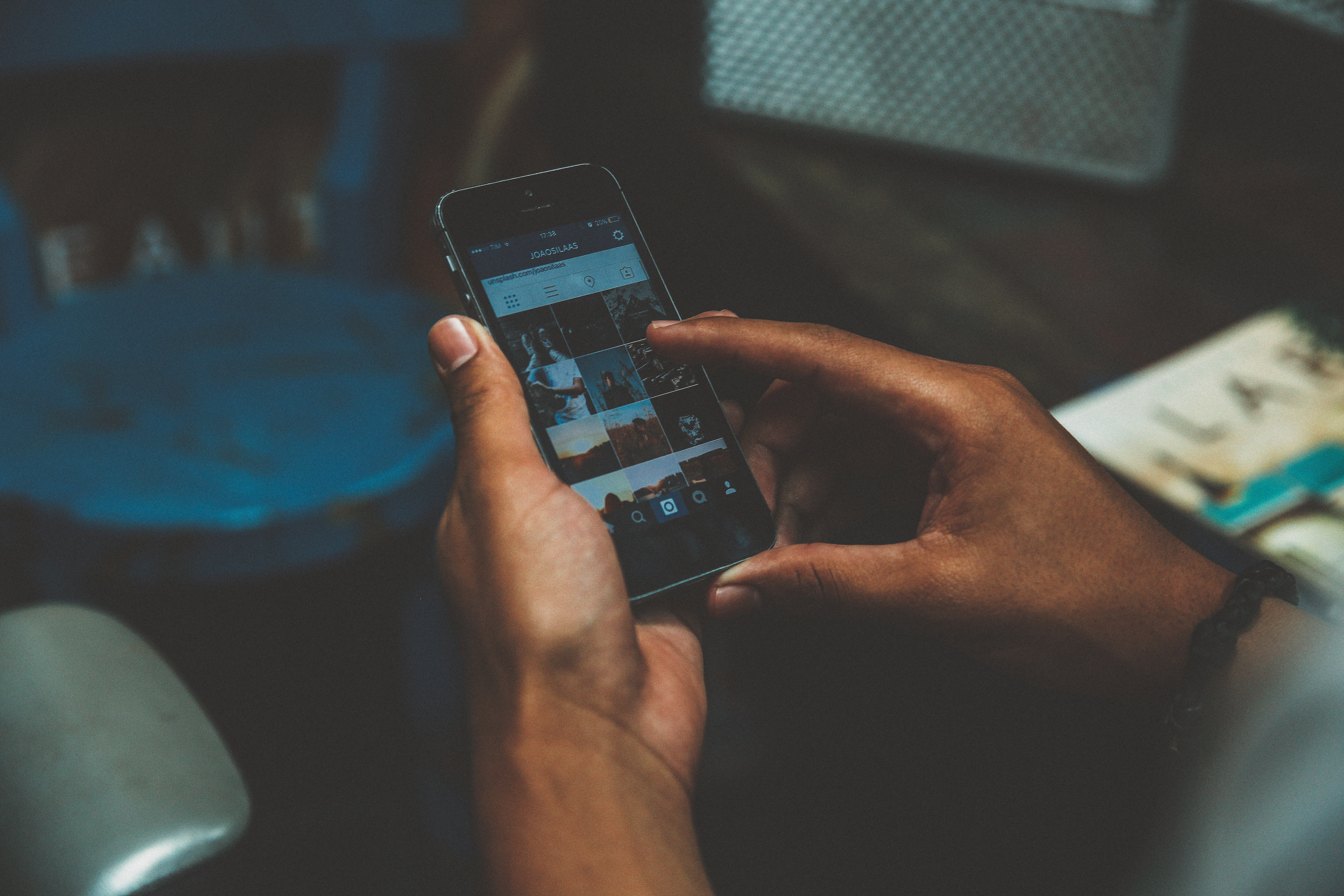 Person holding an iPhone displaying Instagram HD Wallpaper