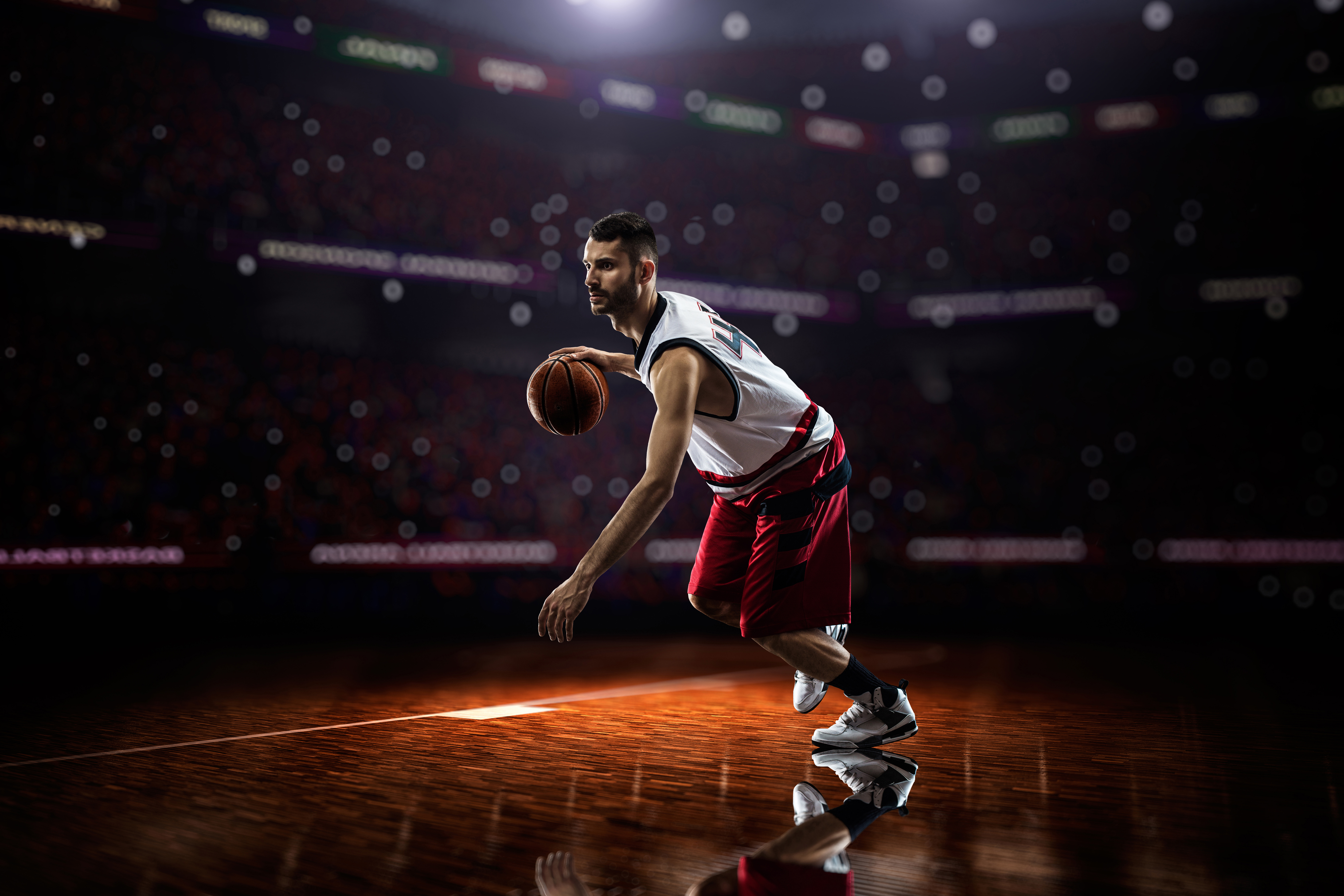 Basketball player dribbling on court HD Wallpaper