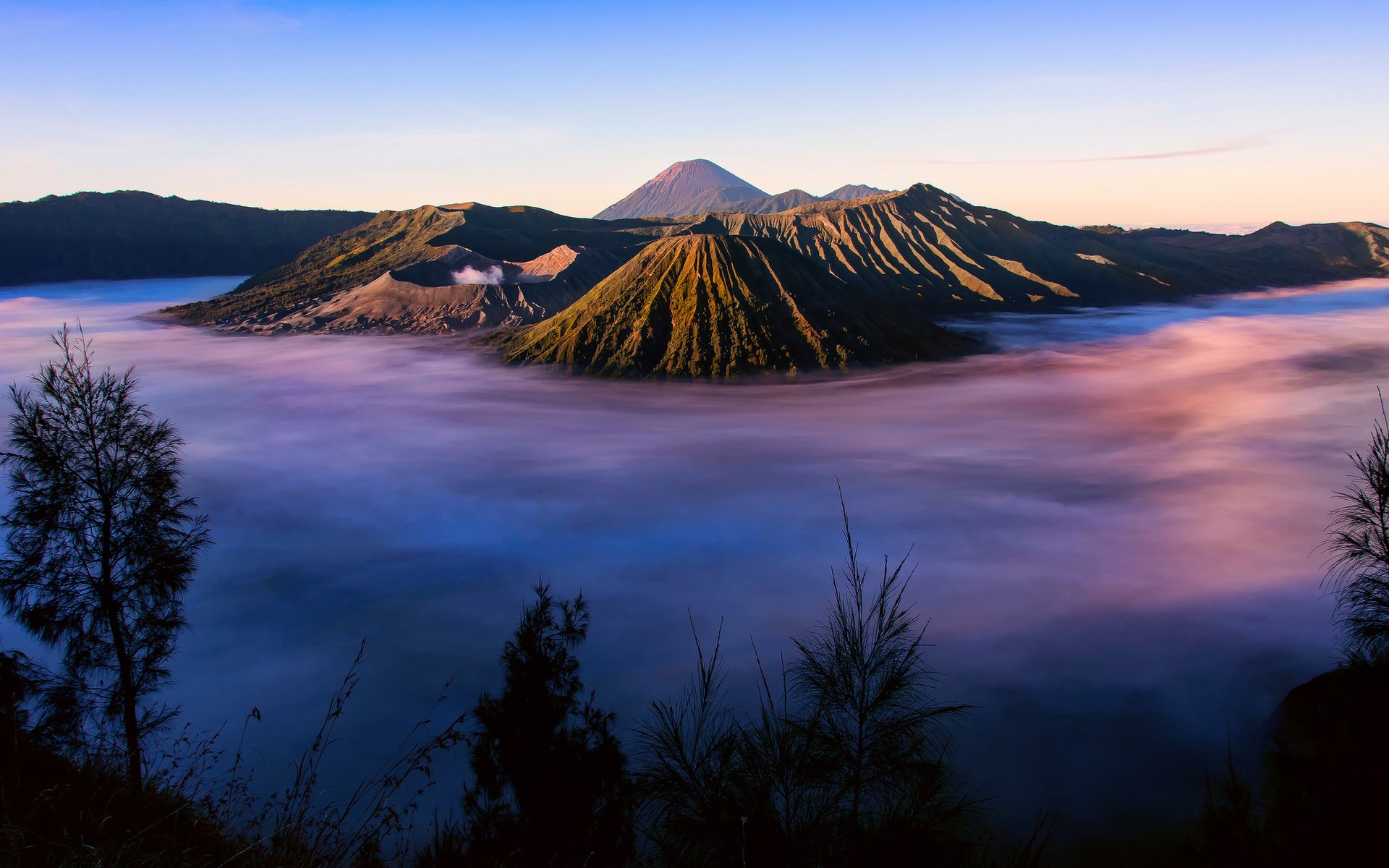 Volcanoes emerge from fog at sunrise HD Wallpaper