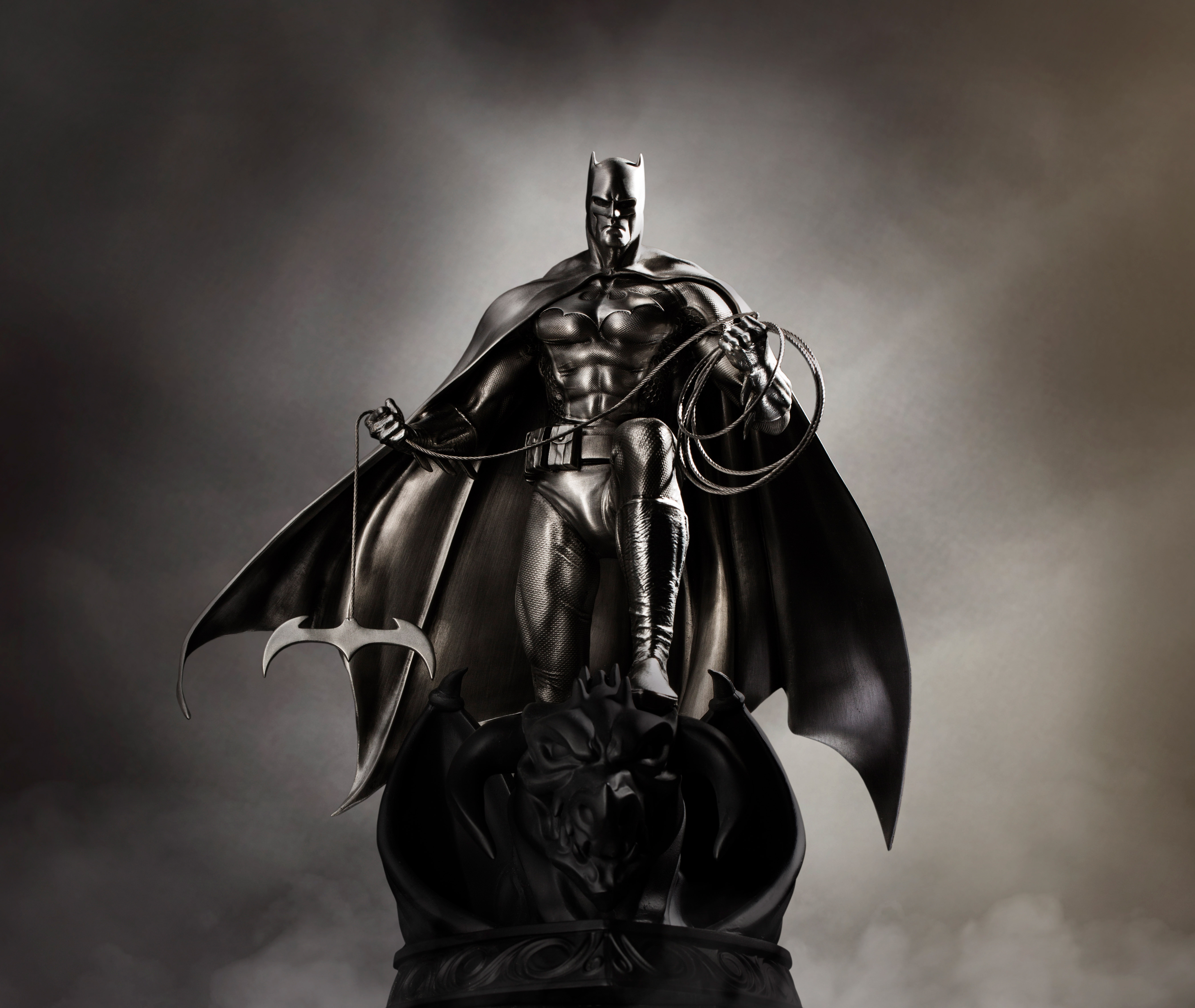 Batman statue with Batarang and grappling hook HD Wallpaper