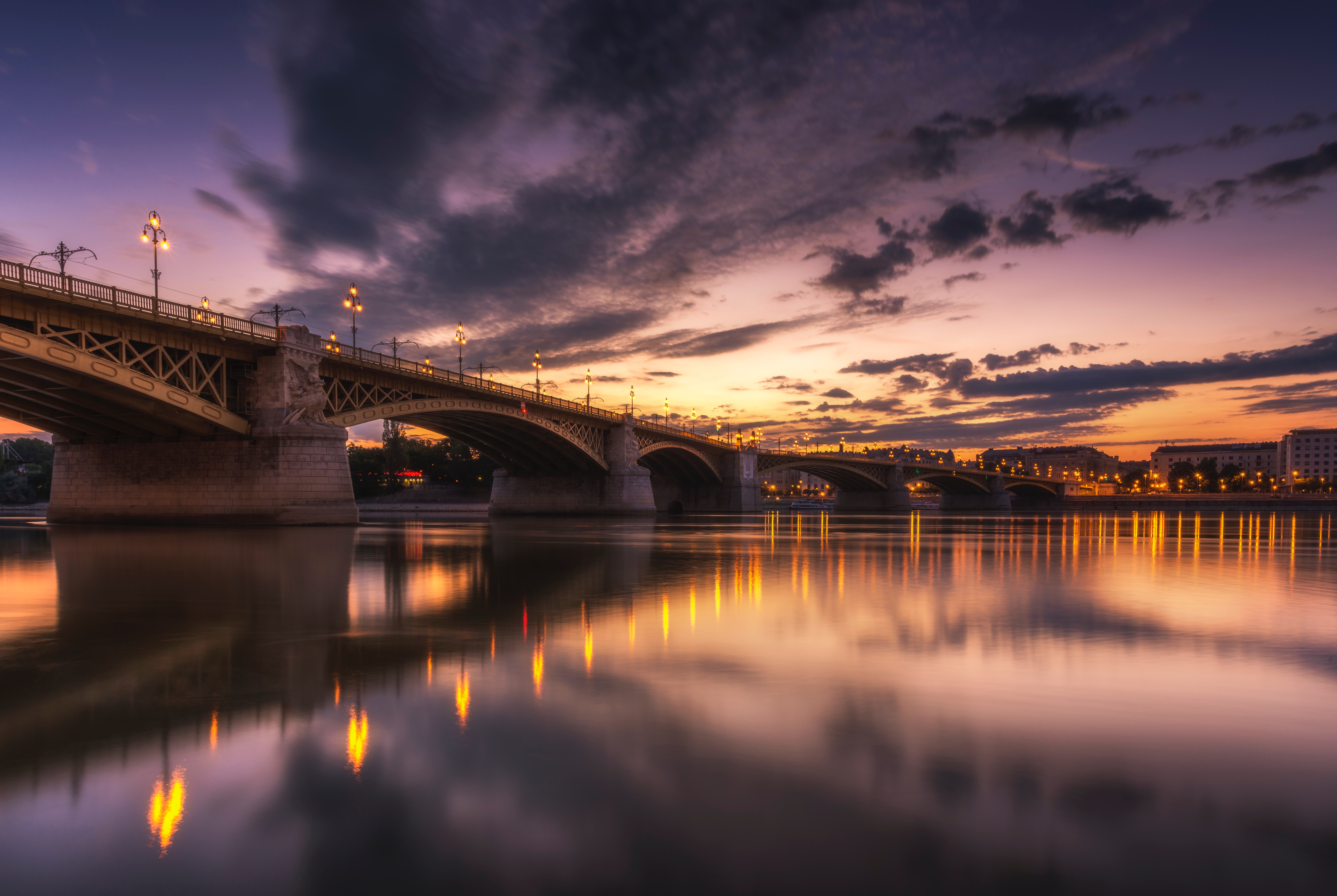 Bridge over river at twilight with city lights reflection HD Wallpaper