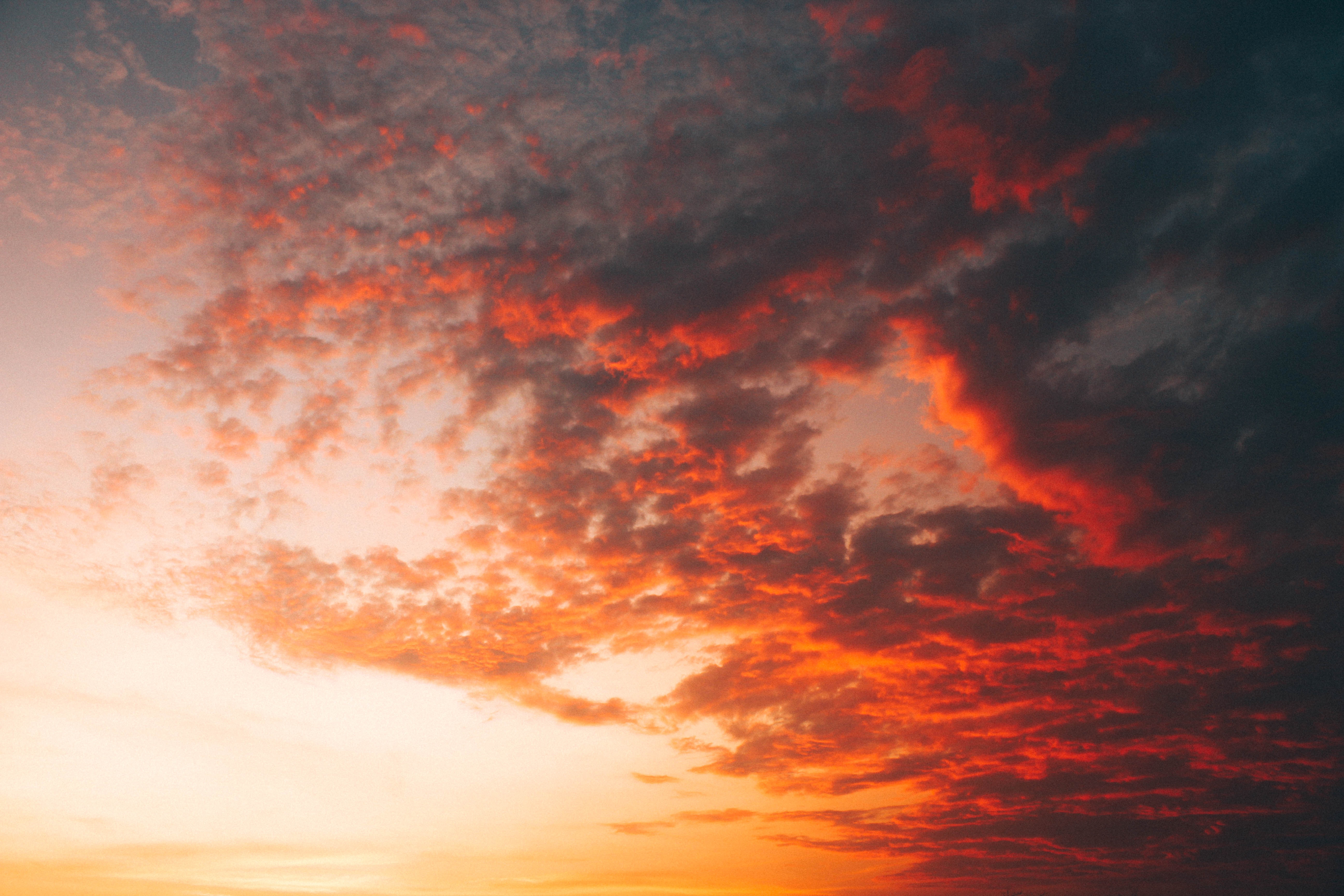 Orange and red clouds at sunset or sunrise HD Wallpaper