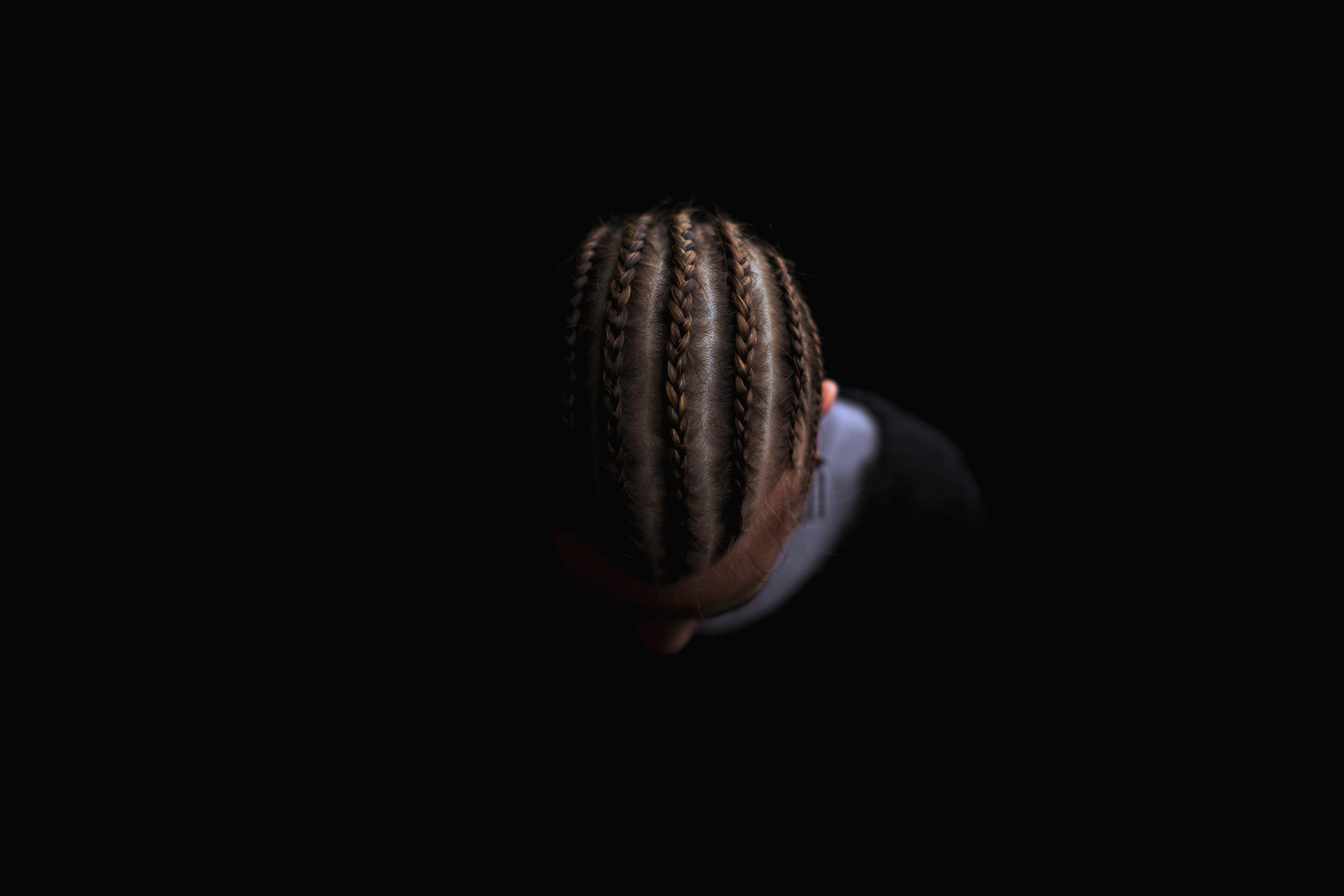 Man with braided hair from a top-down view HD Wallpaper