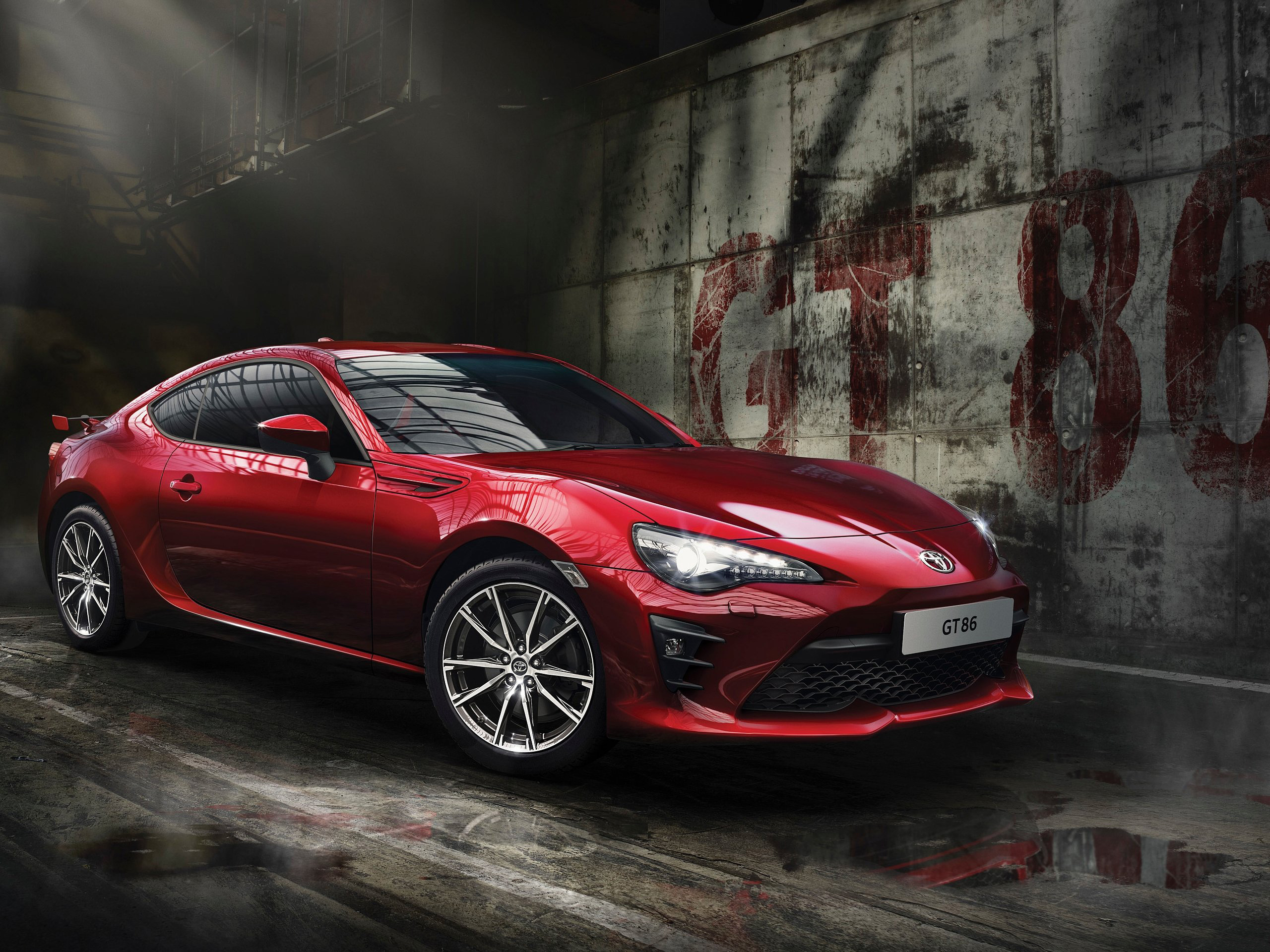 Red Toyota GT86 in a gritty urban setting HD Wallpaper