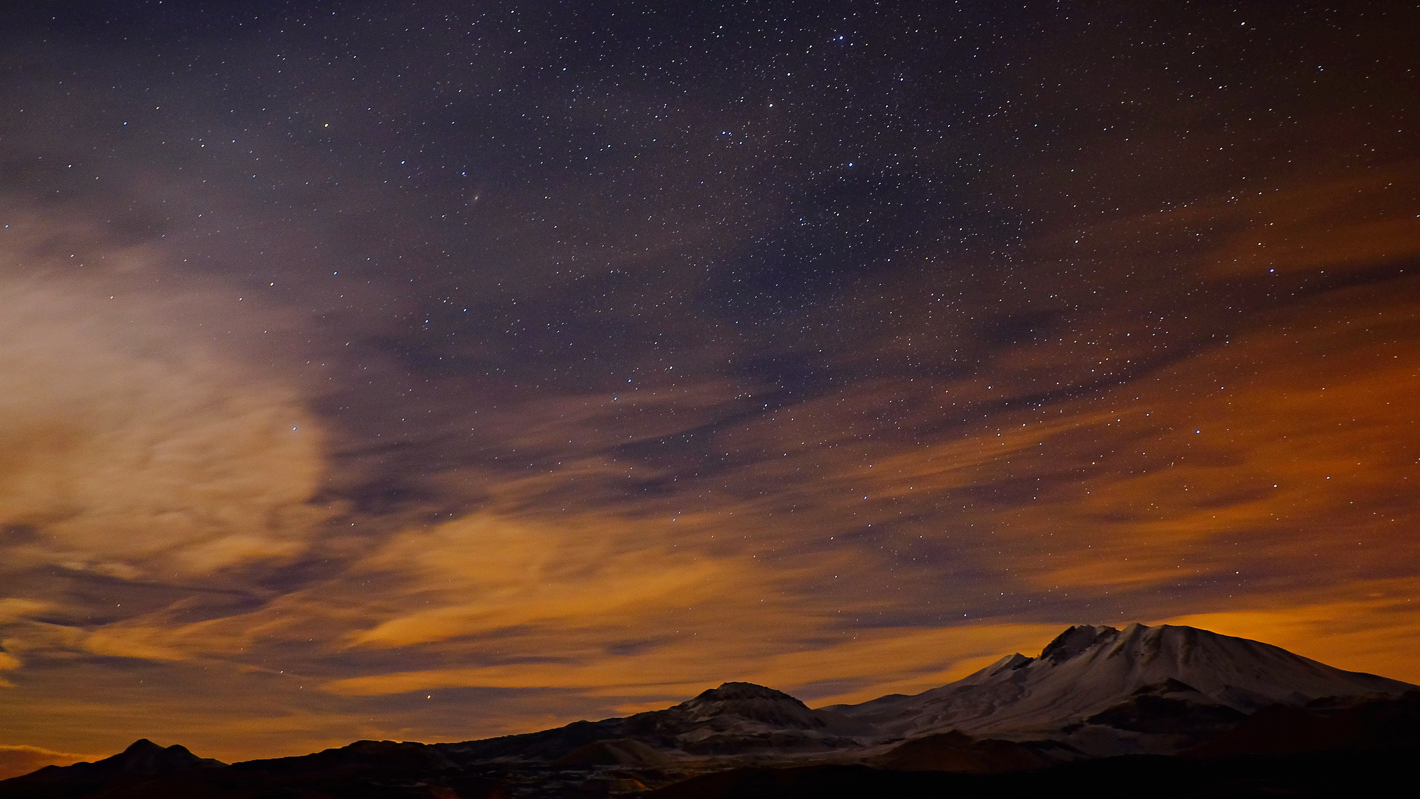 Starry night sky over snow-capped mountains HD Wallpaper