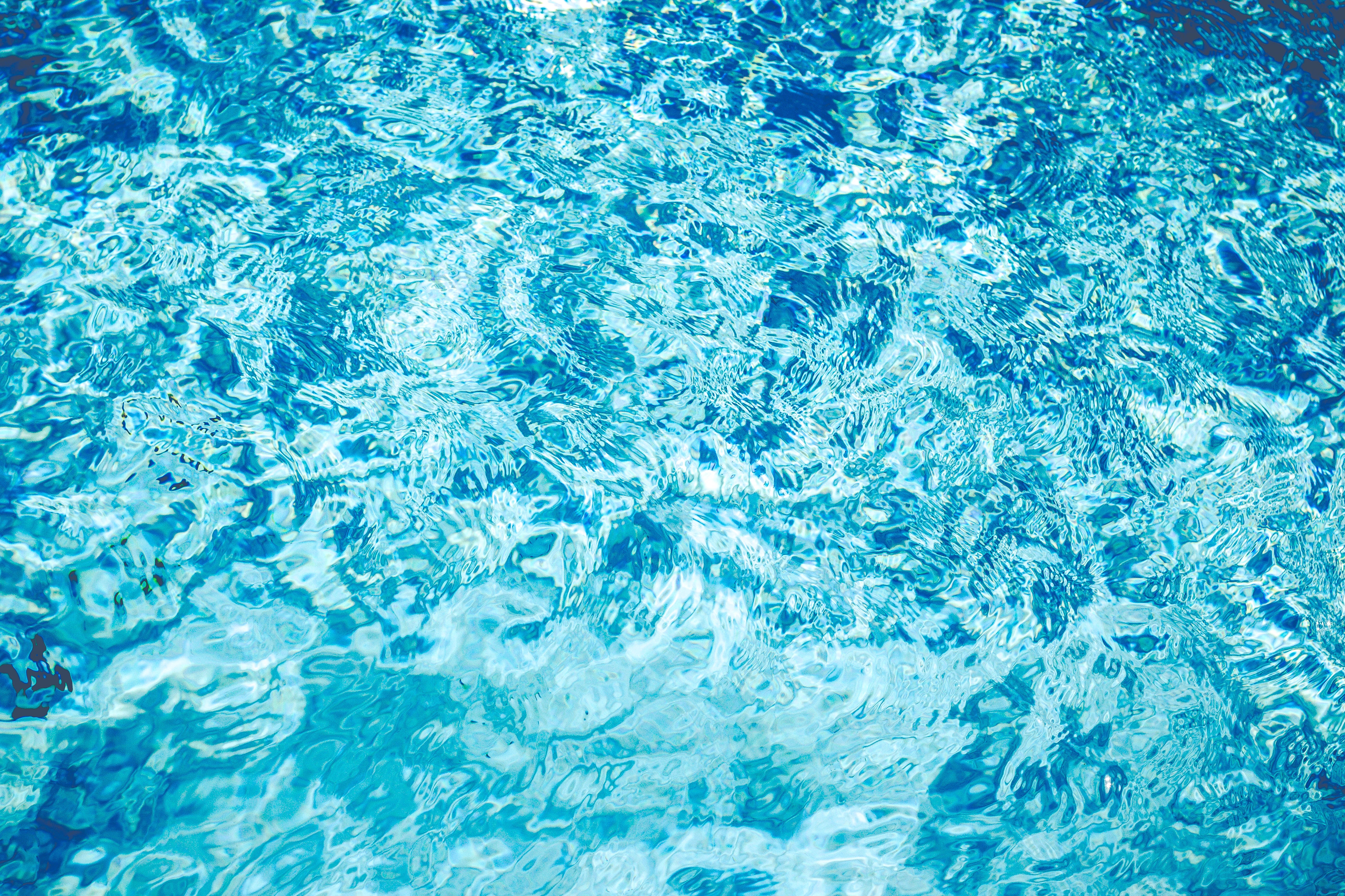 Turquoise water surface with ripples HD Wallpaper