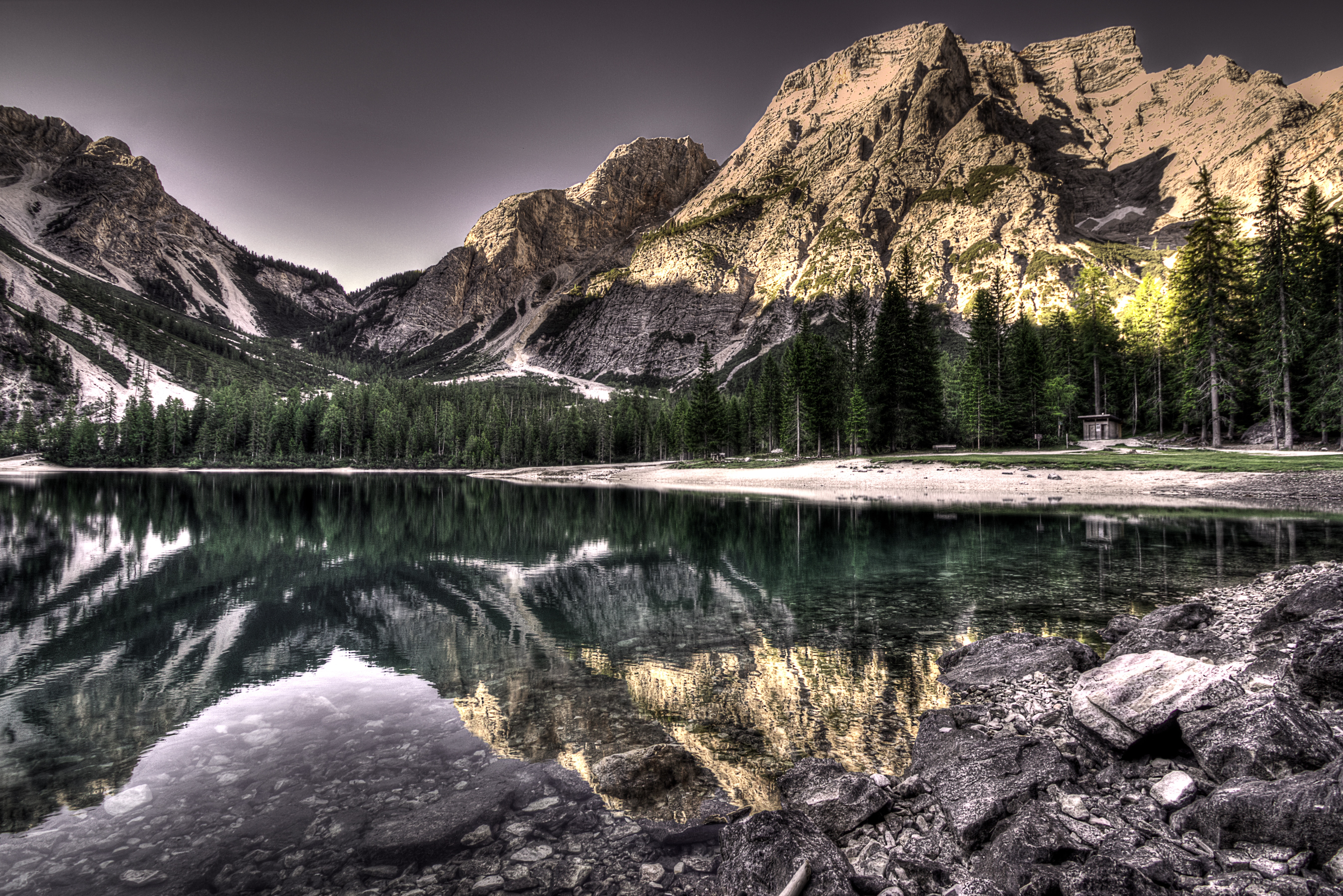 Mountain lake with reflections and rocky shore HD Wallpaper