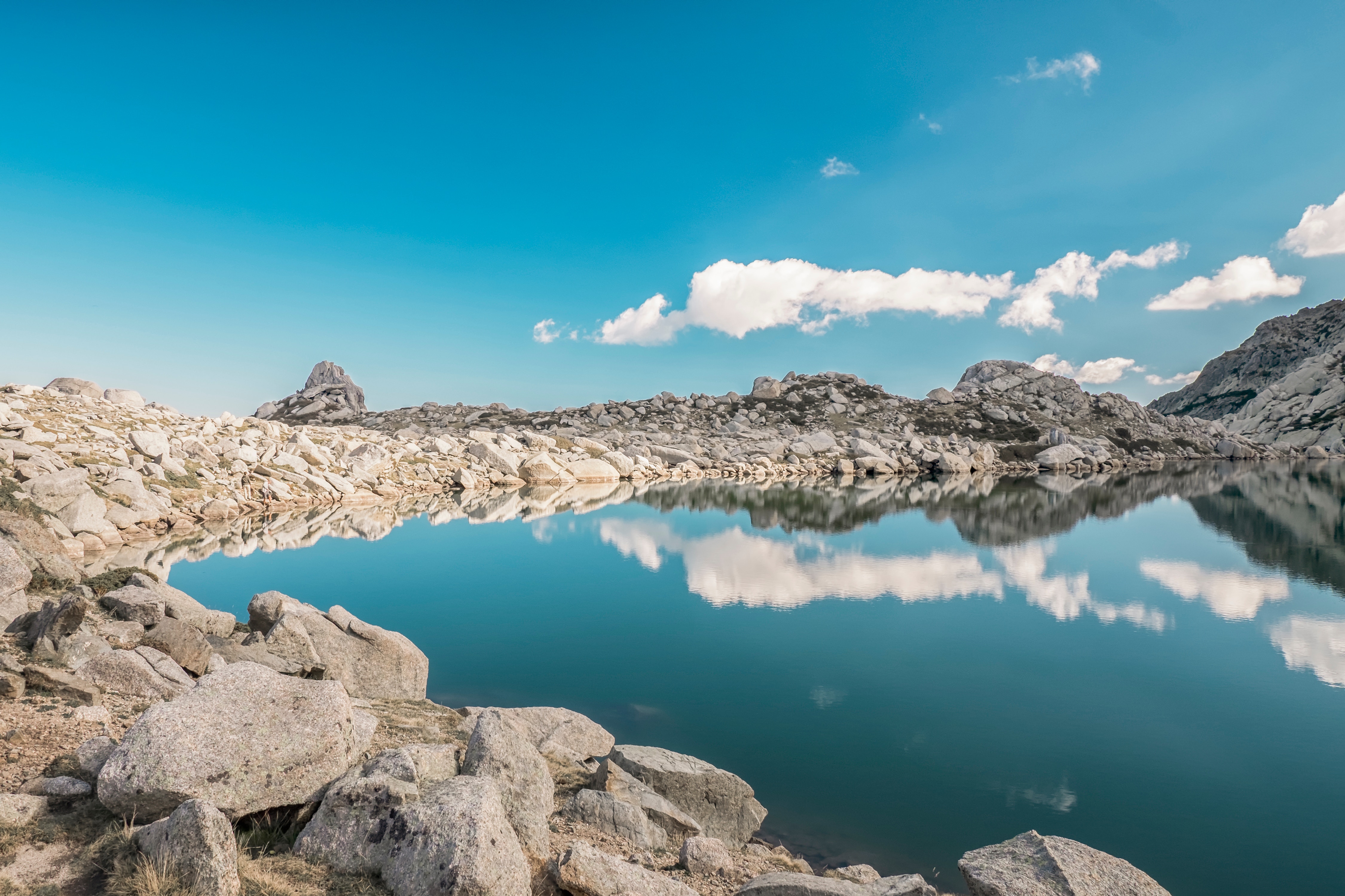 Lake reflection in Corsica, France with rocky mountains HD Wallpaper