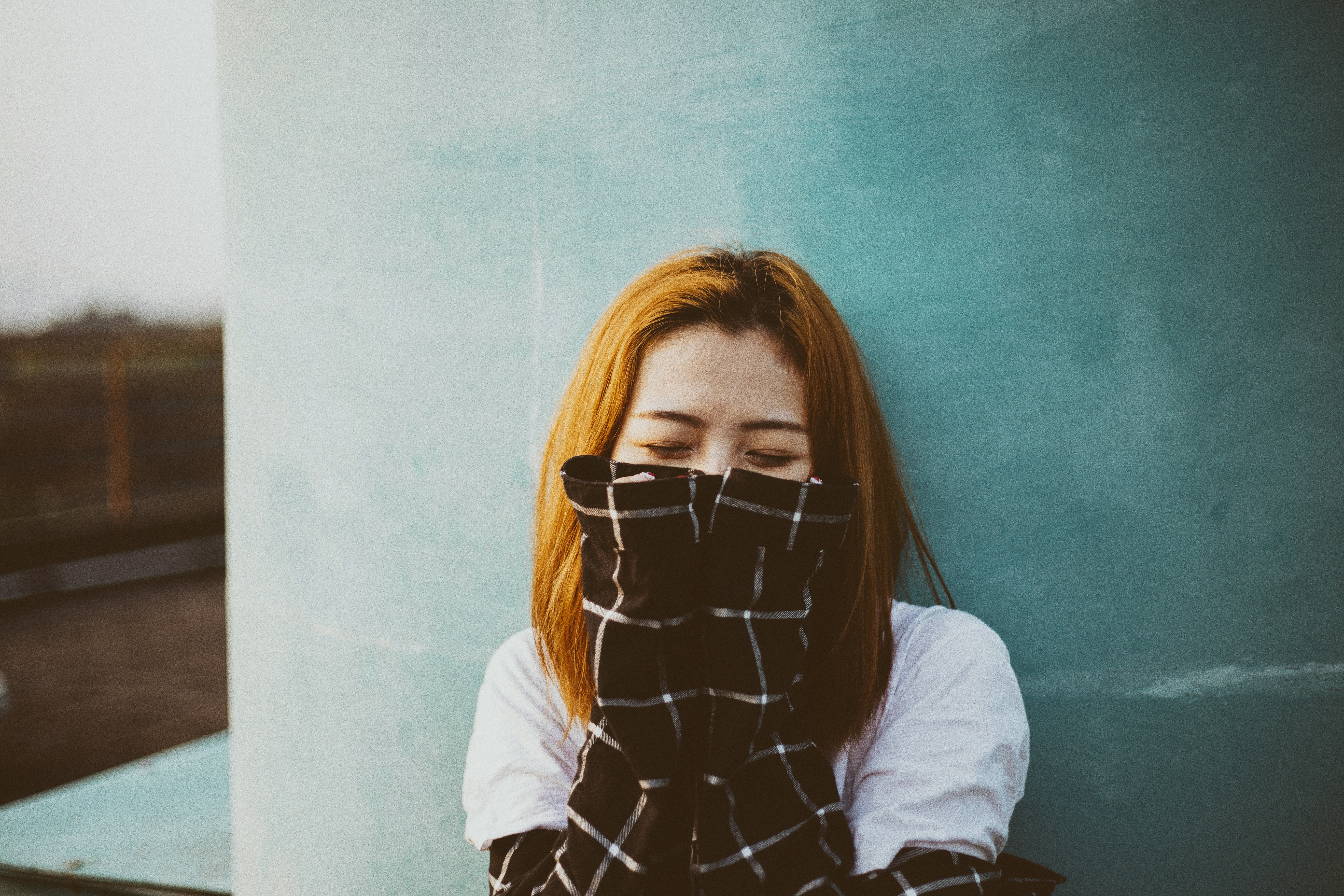 Asian woman covering face with plaid shirt HD Wallpaper