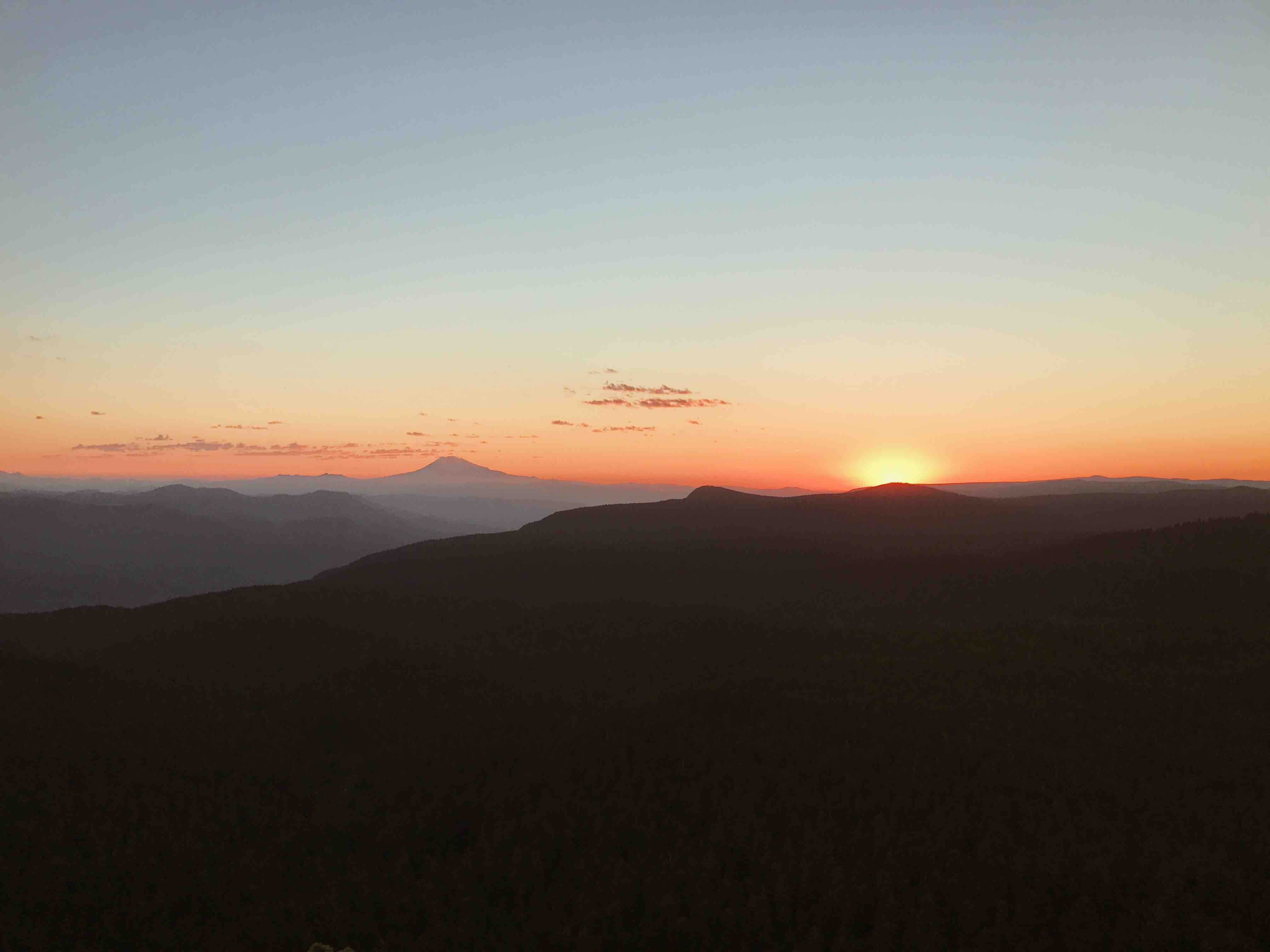 Sunset over Mount Adams with silhouetted mountains HD Wallpaper