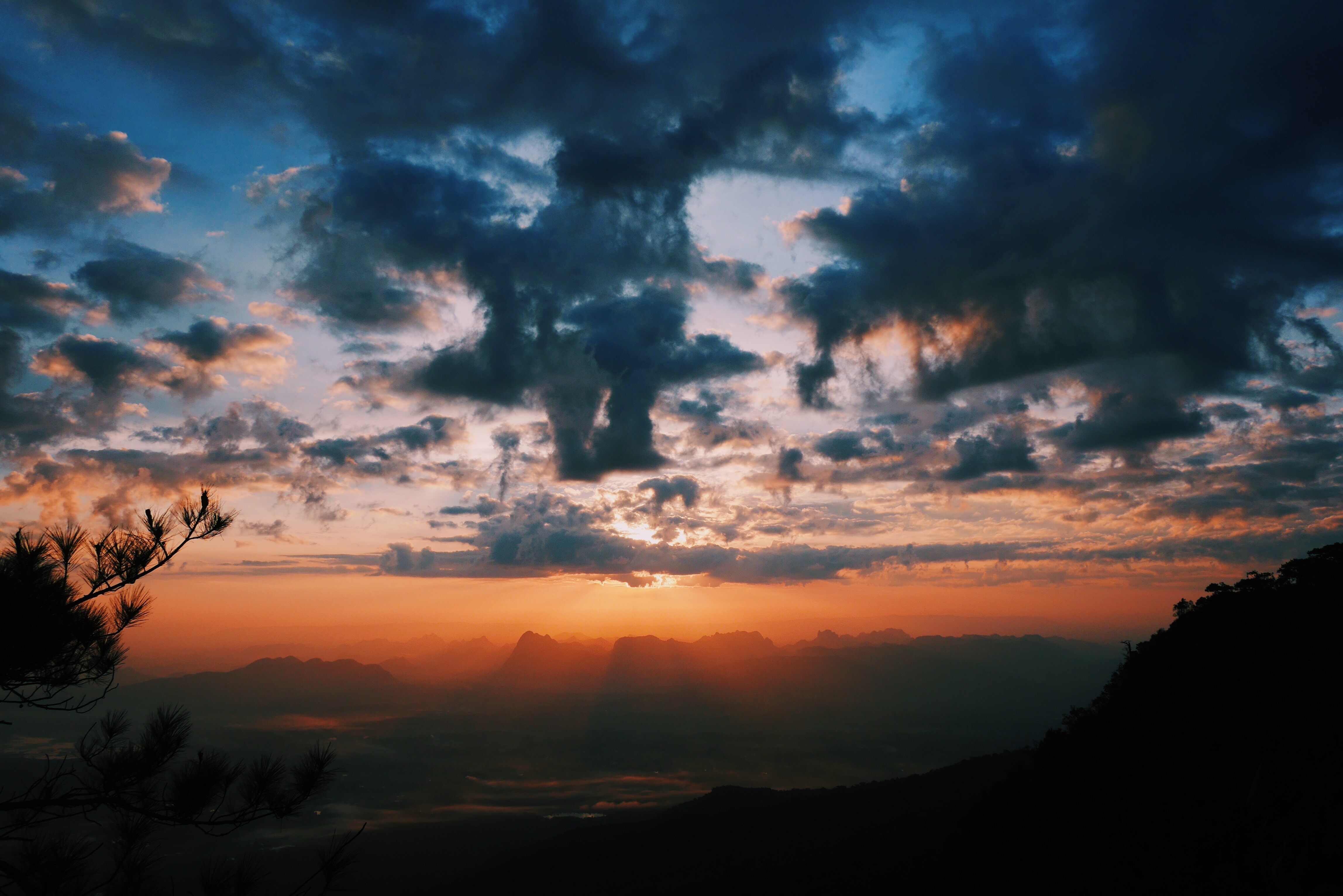 Sunset over mountains with dramatic clouds HD Wallpaper