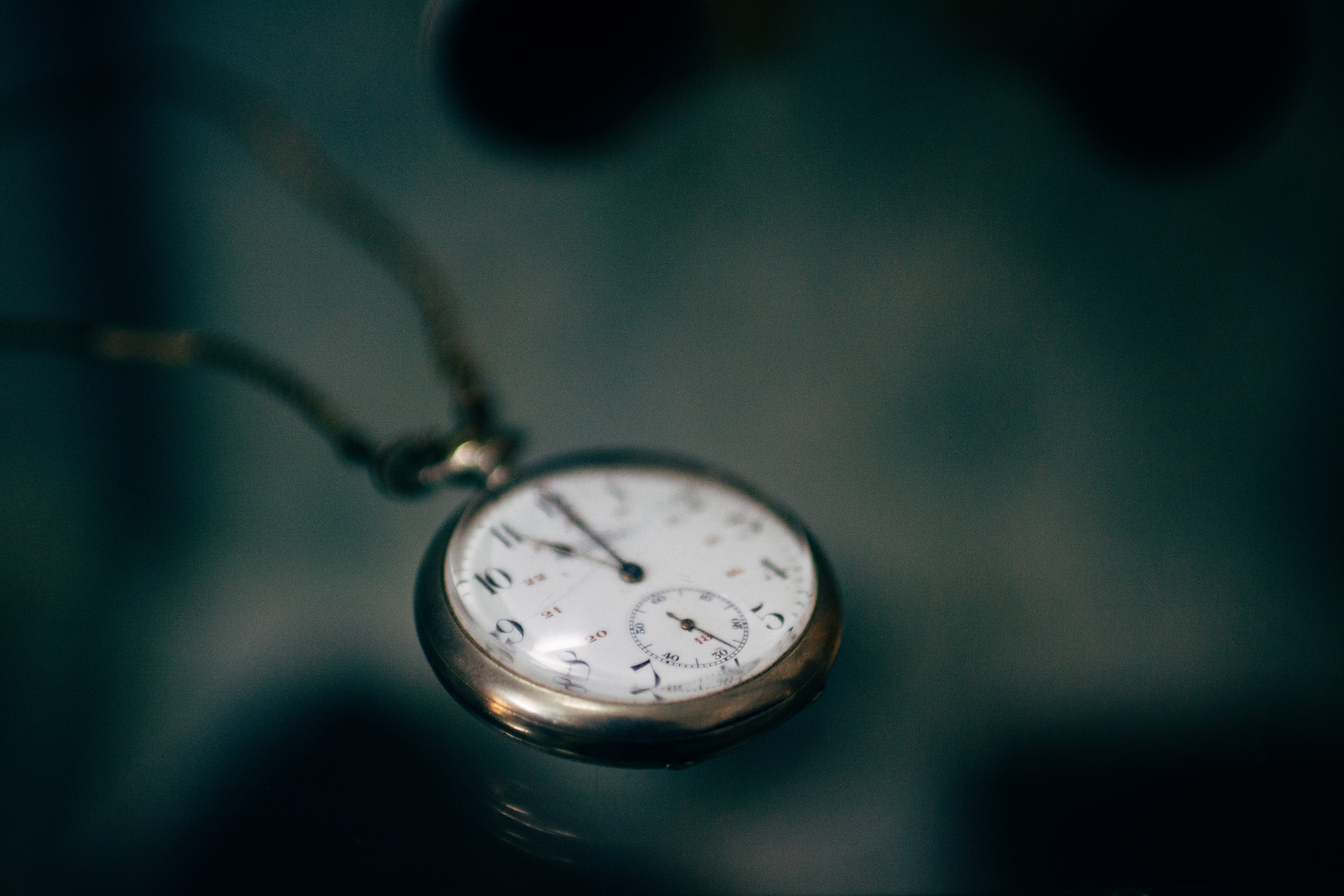 Close up of a vintage pocket watch with a watch chain HD Wallpaper