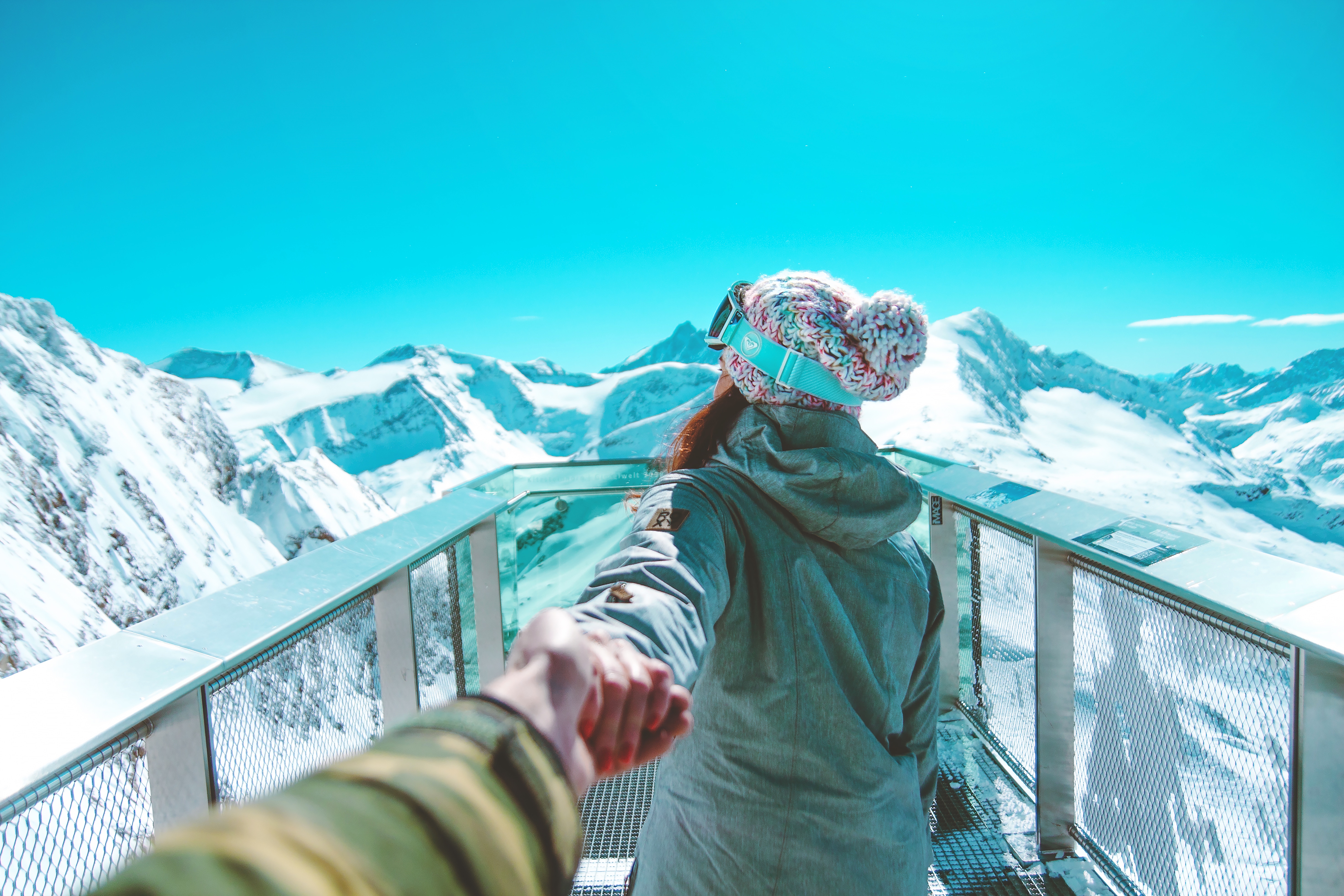 Woman in ski gear on a mountain viewpoint HD Wallpaper