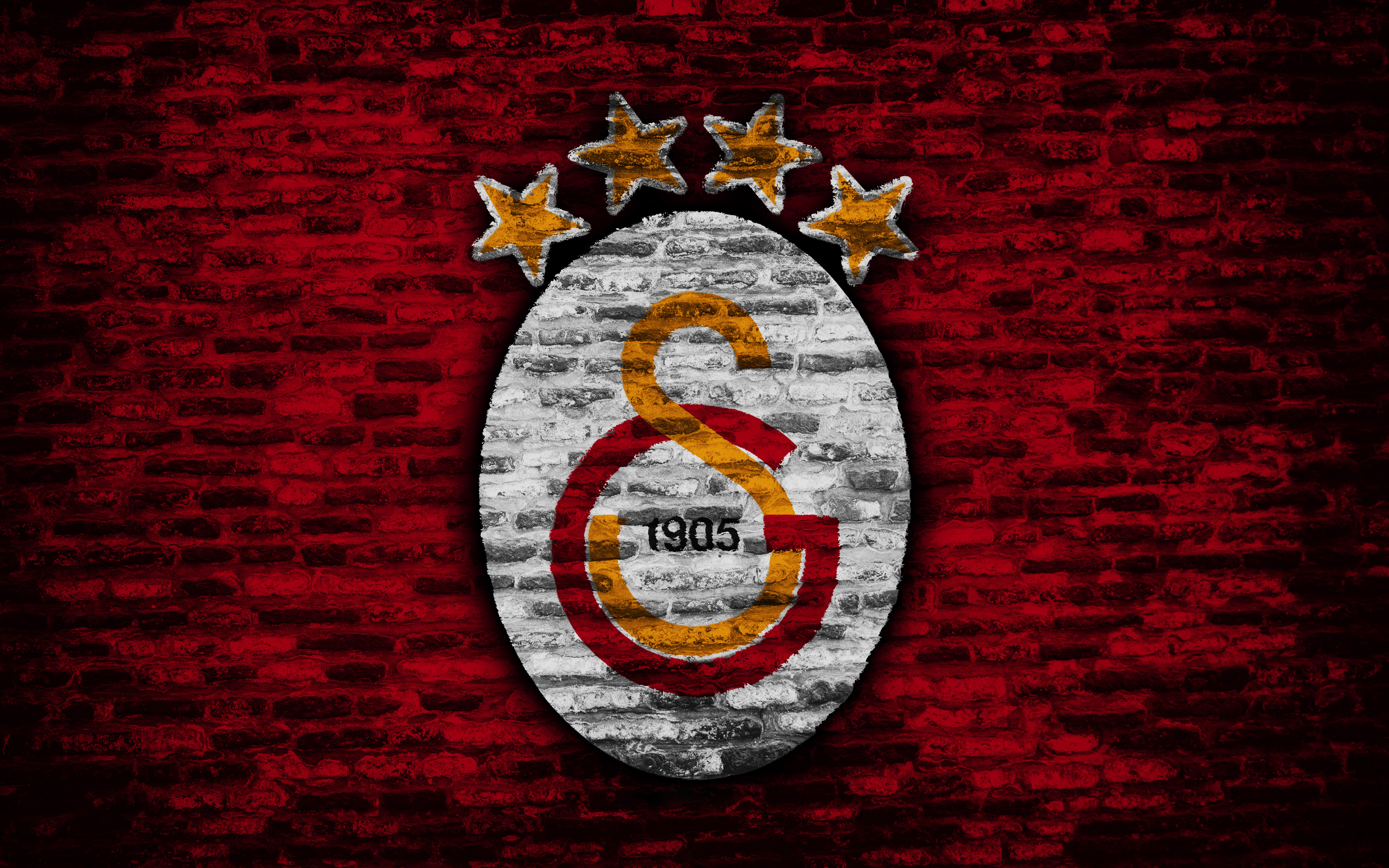 Galatasaray S.K. logo with stars on brick wall HD Wallpaper