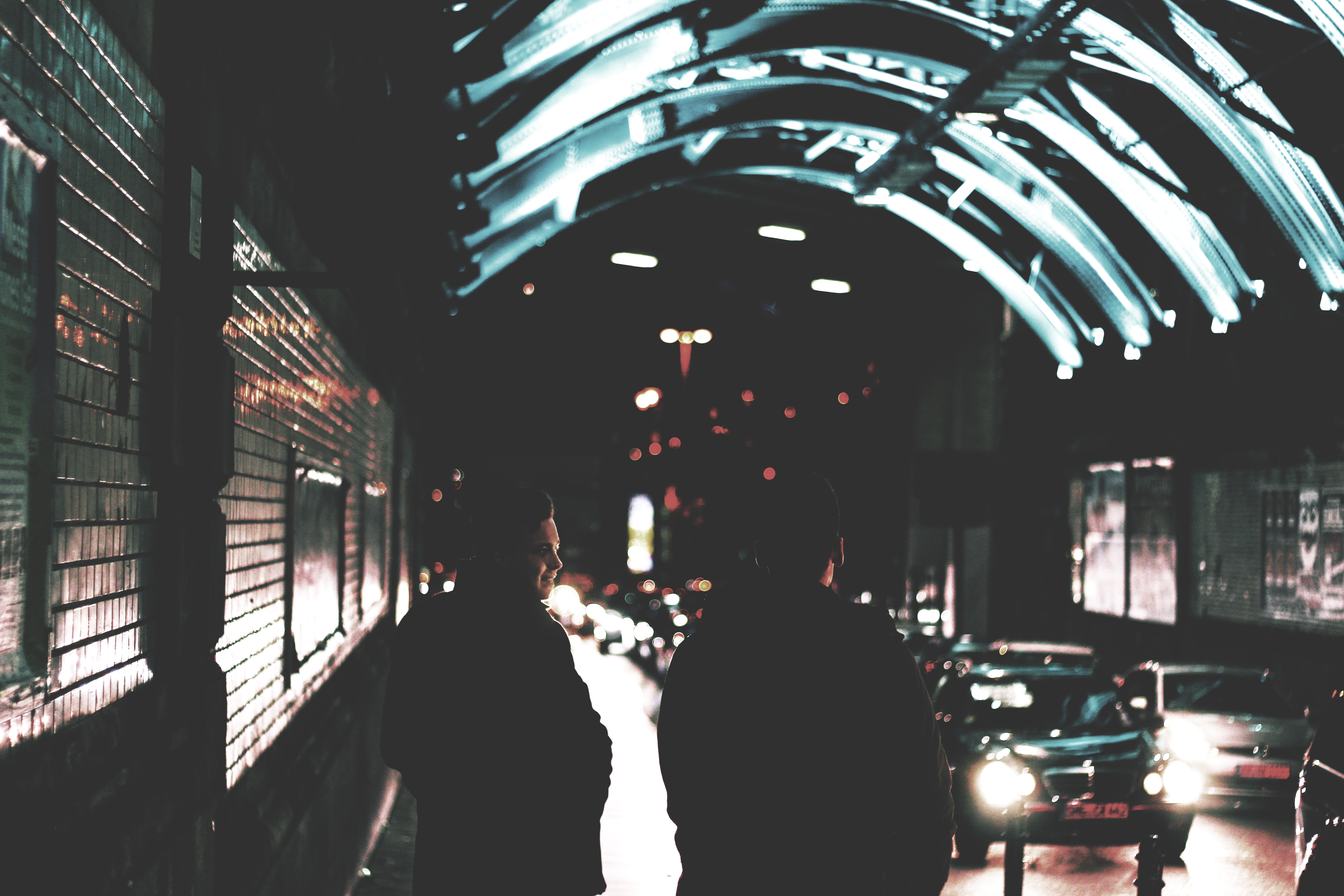 Two people in a tunnel at night in Cologne HD Wallpaper
