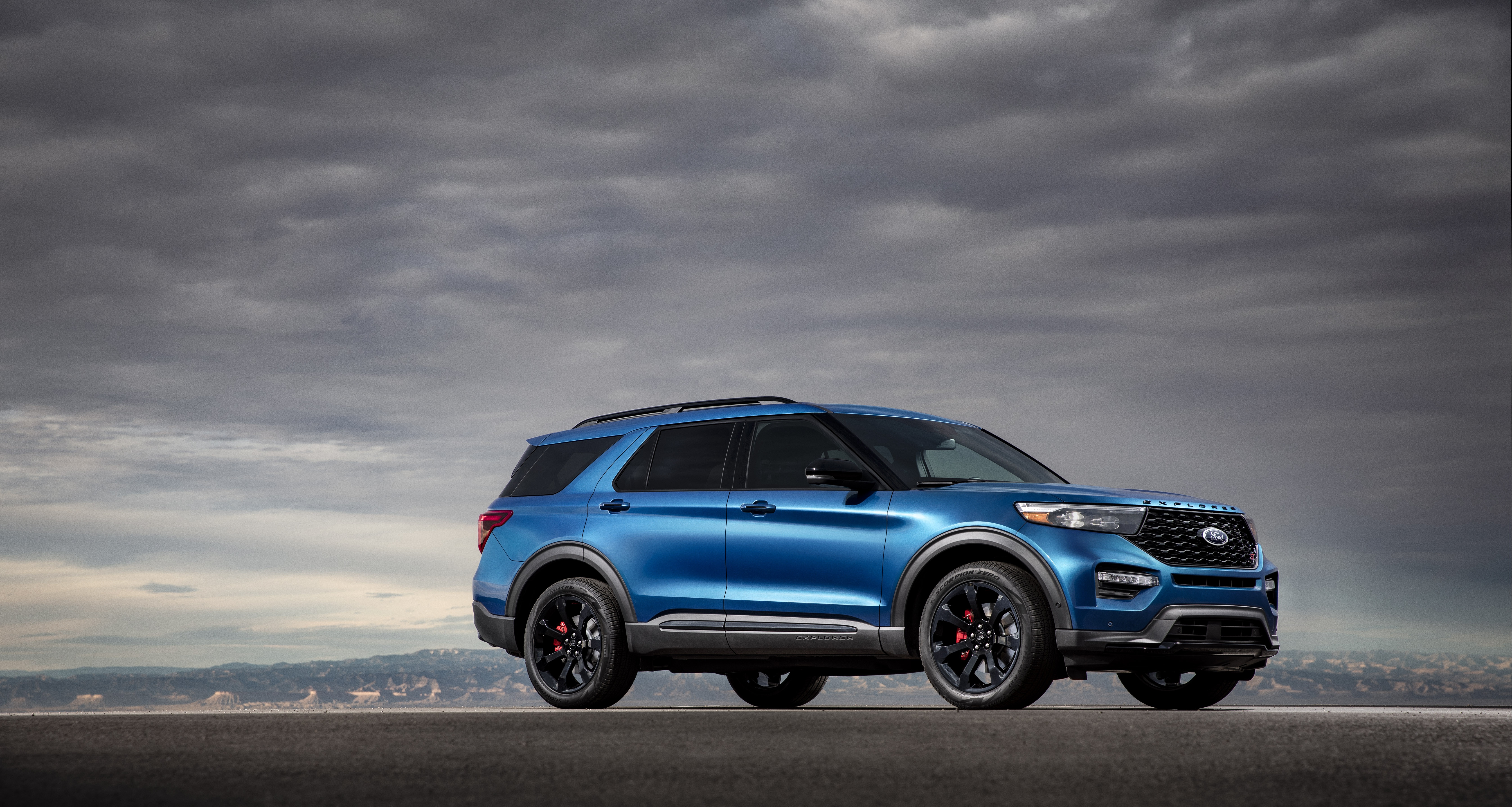 Blue Ford Explorer SUV parked outdoors HD Wallpaper
