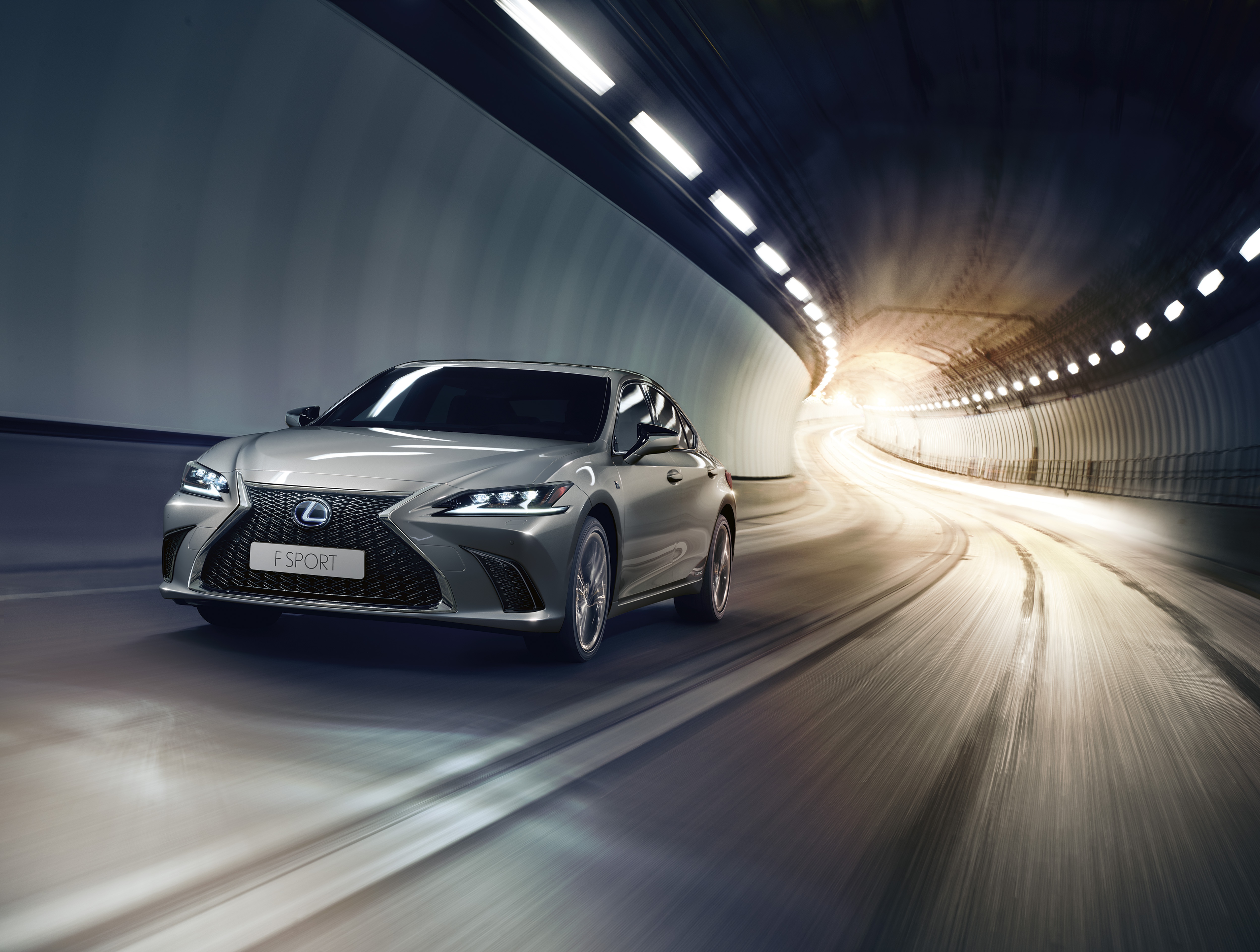 Silver Lexus ES 300H F Sport driving through a tunnel HD Wallpaper
