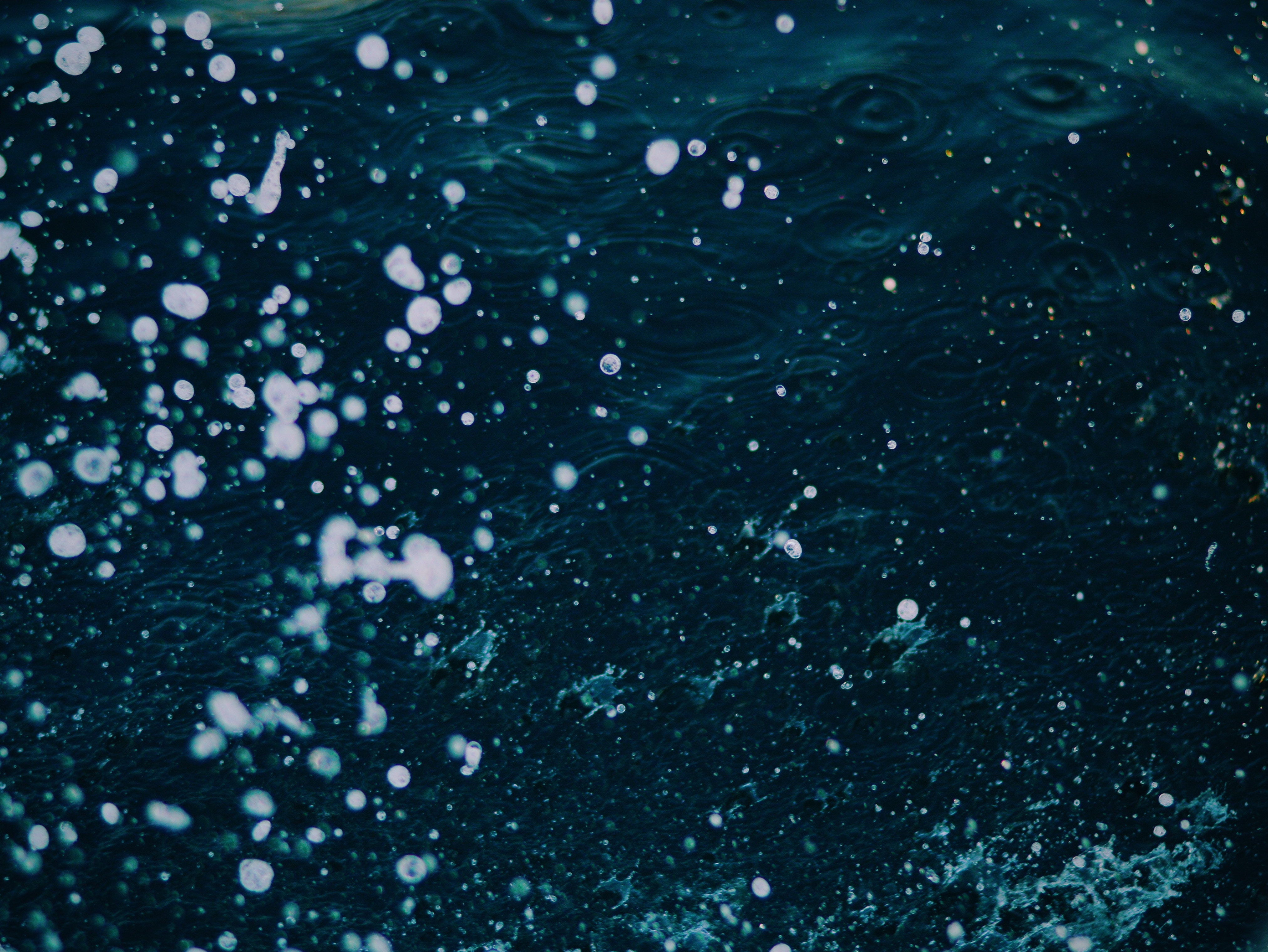 Close up of water with bubbles and ripples HD Wallpaper